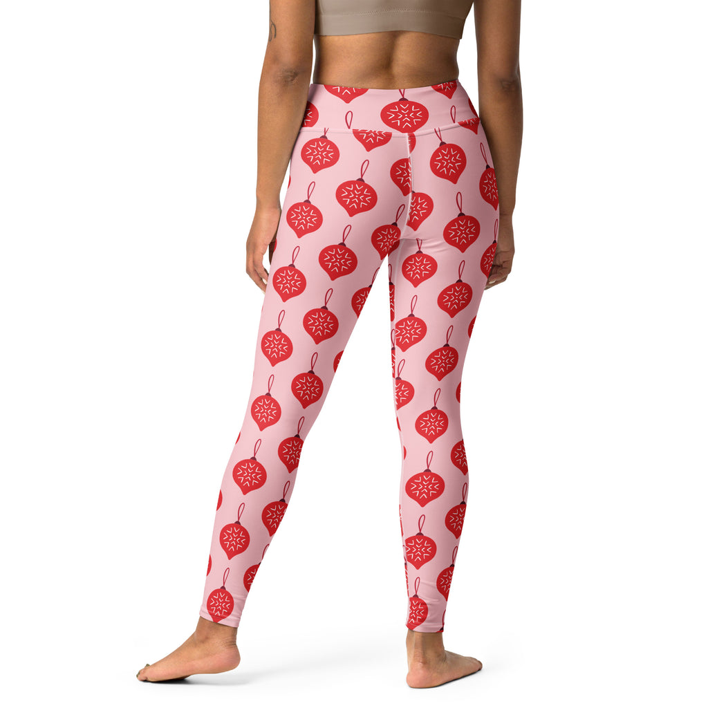 Women’s pink buttery soft yoga leggings with red christmas ornament and white snowflake pattern