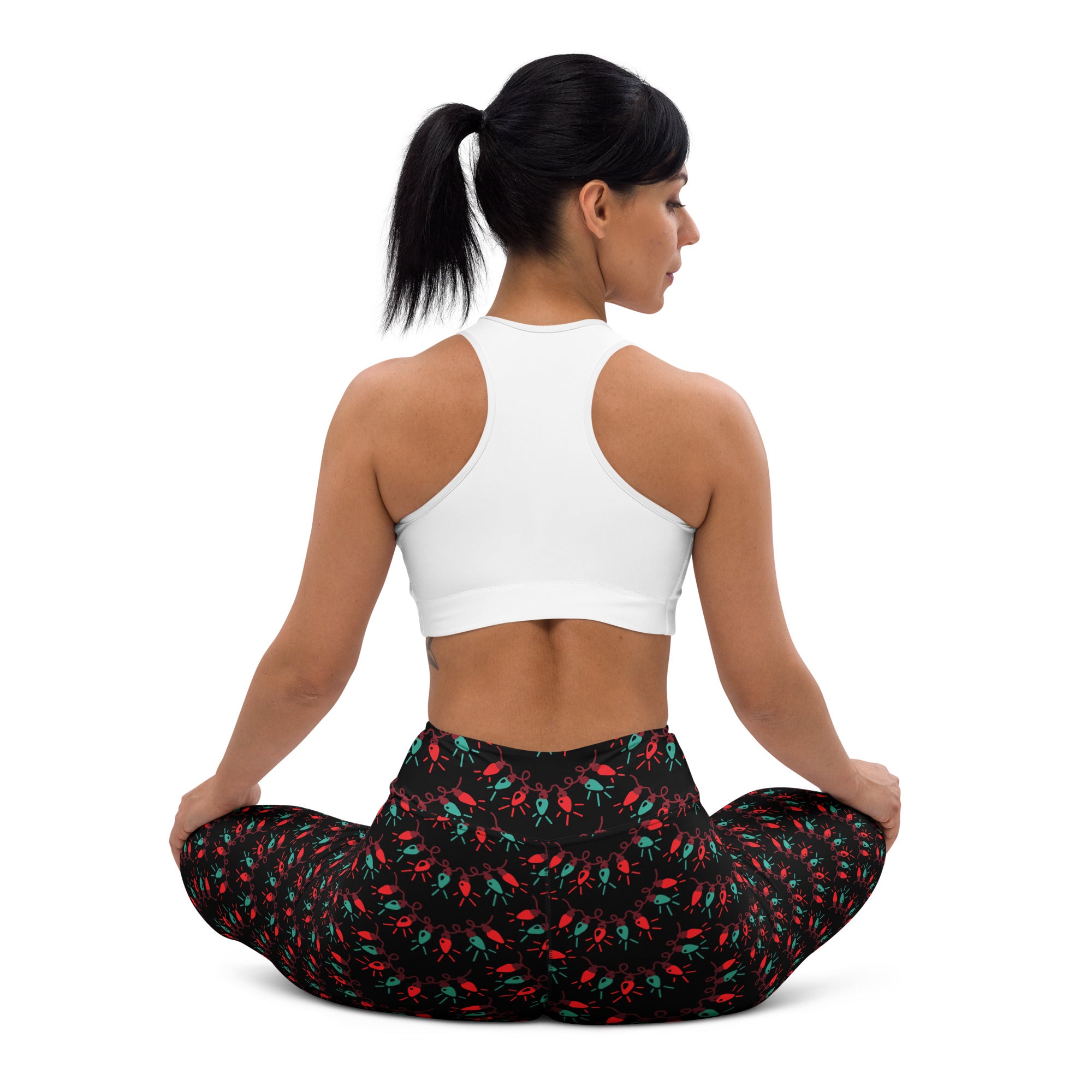 Black buttery soft women’s yoga leggings with vibrant red and green stylized insect pattern for christmas lights