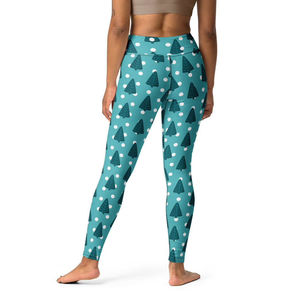 Women’s teal high-waisted yoga leggings with dark green pine tree pattern and white polka dots buttery soft fabric