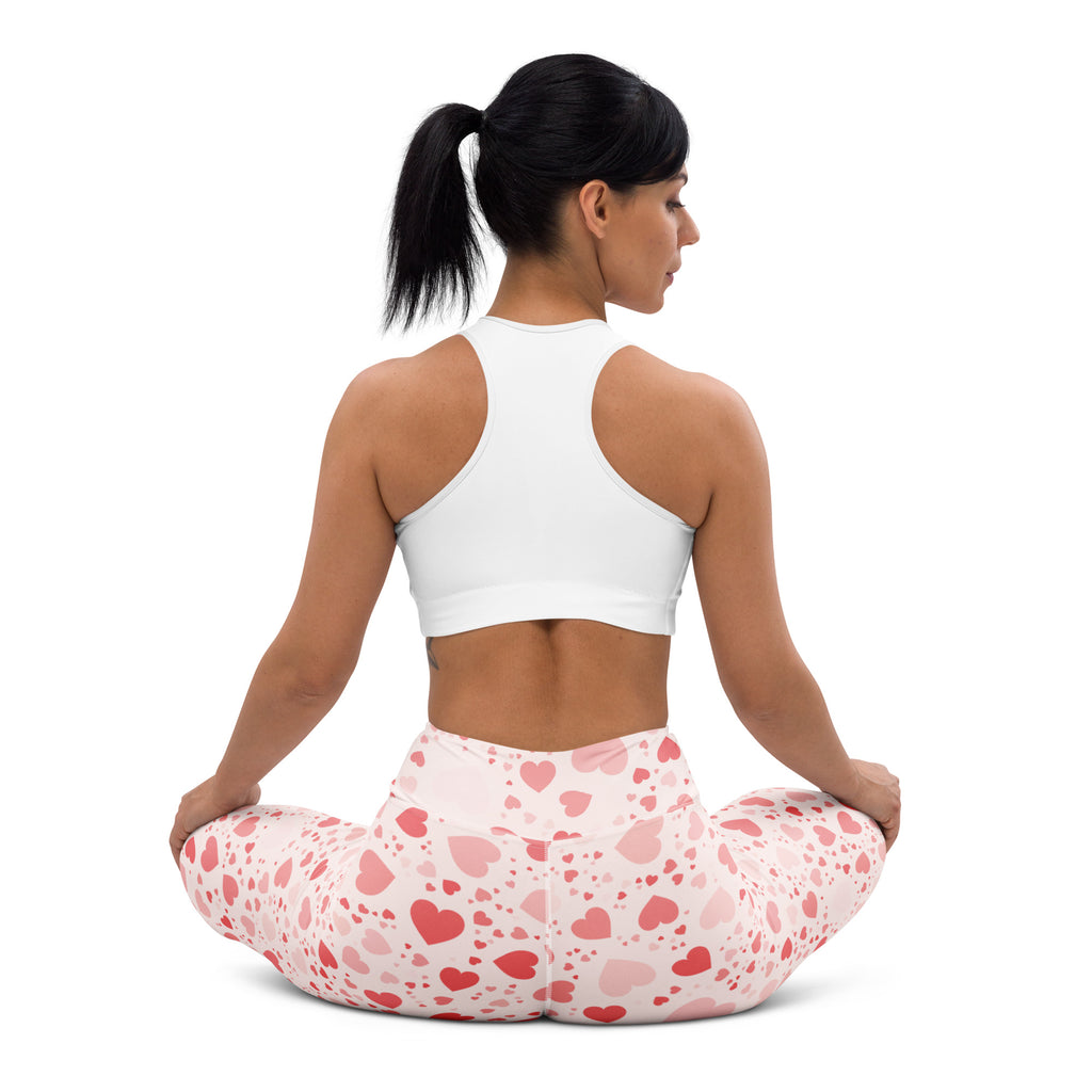 Women soft pink heart buttery soft high waisted yoga leggings paired with white sports bra for quick drying comfort