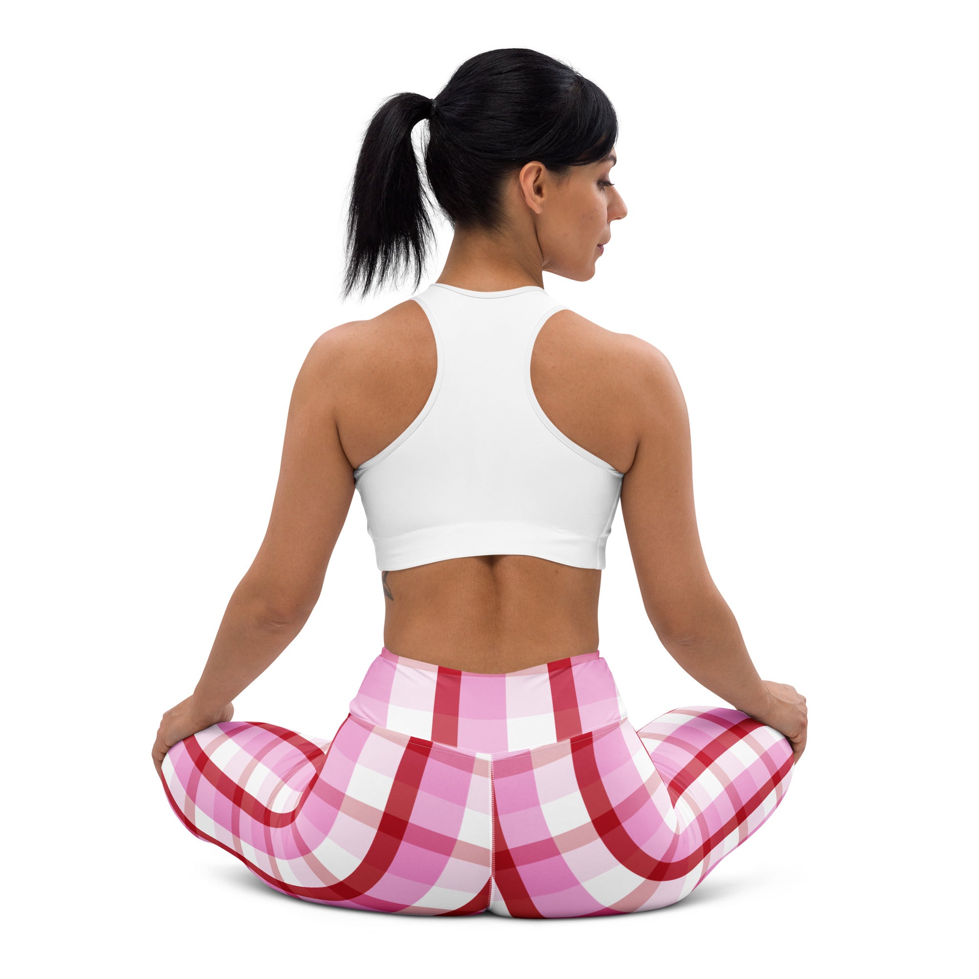 Women’s pink and red plaid high waisted yoga leggings made from buttery soft quick drying fabric for comfort