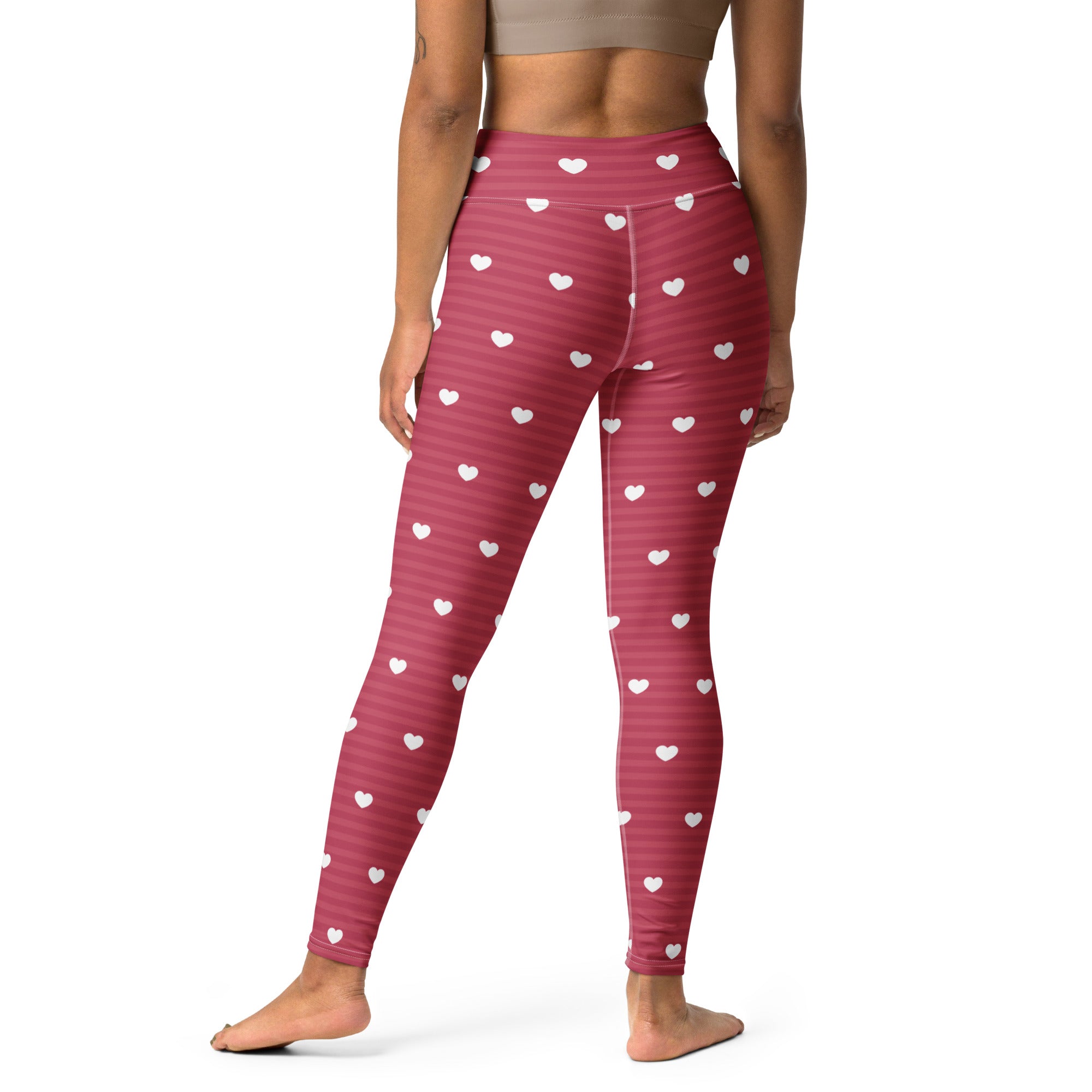 Women’s pink heart-patterned high-waisted leggings with subtle horizontal stripes buttery soft and quick drying