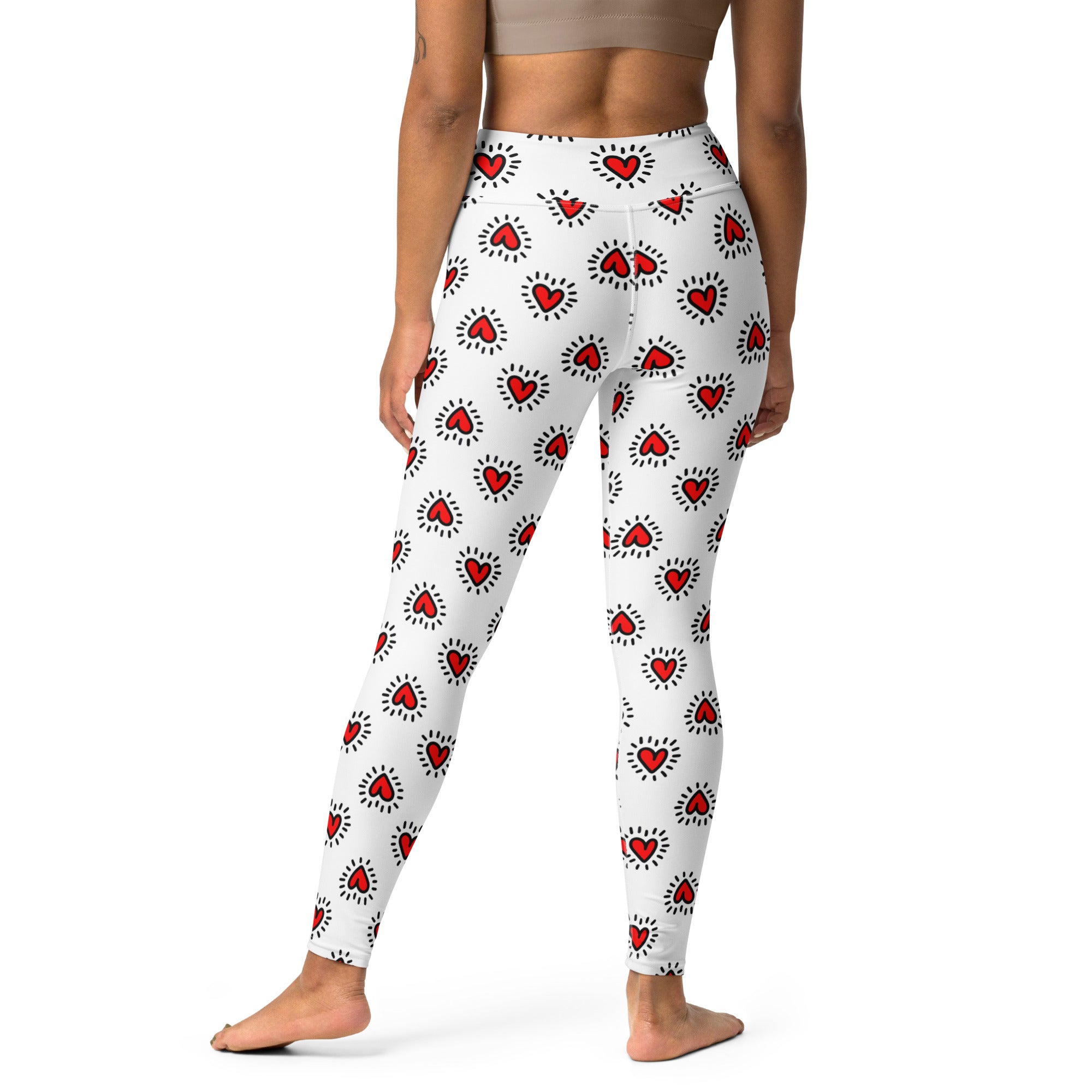 Women’s white buttery soft high waisted yoga leggings with red heart pattern and quick drying fabric