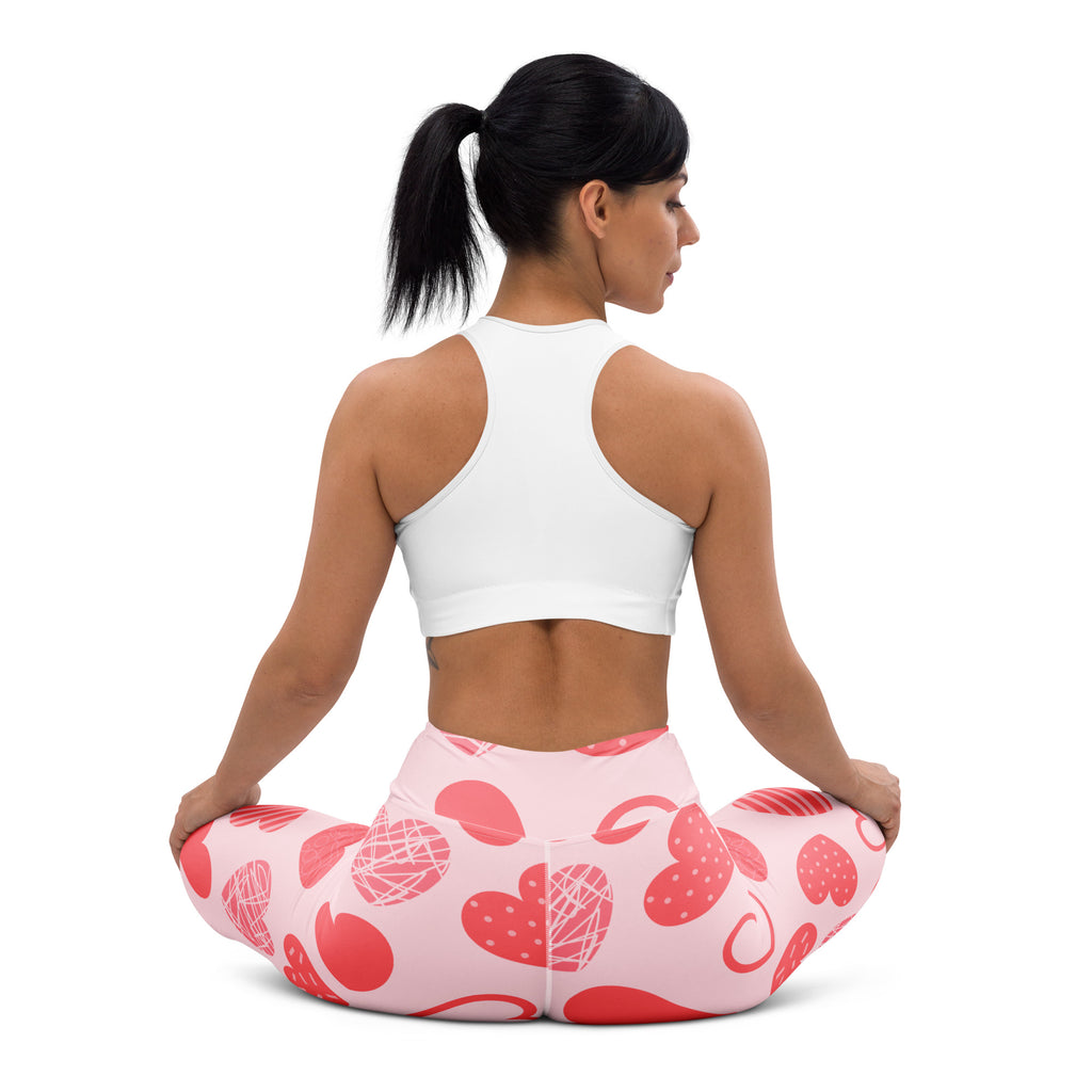 Women’s pink buttery soft yoga leggings with red heart pattern and white scribbles high waisted quick drying