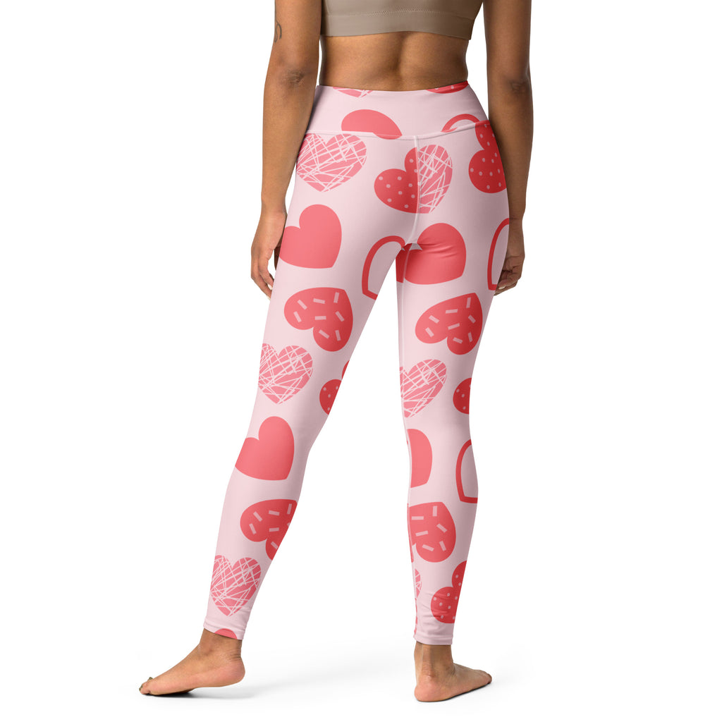 Women’s pink heart pattern high waisted yoga leggings made of buttery soft stretchy fabric with quick drying comfort