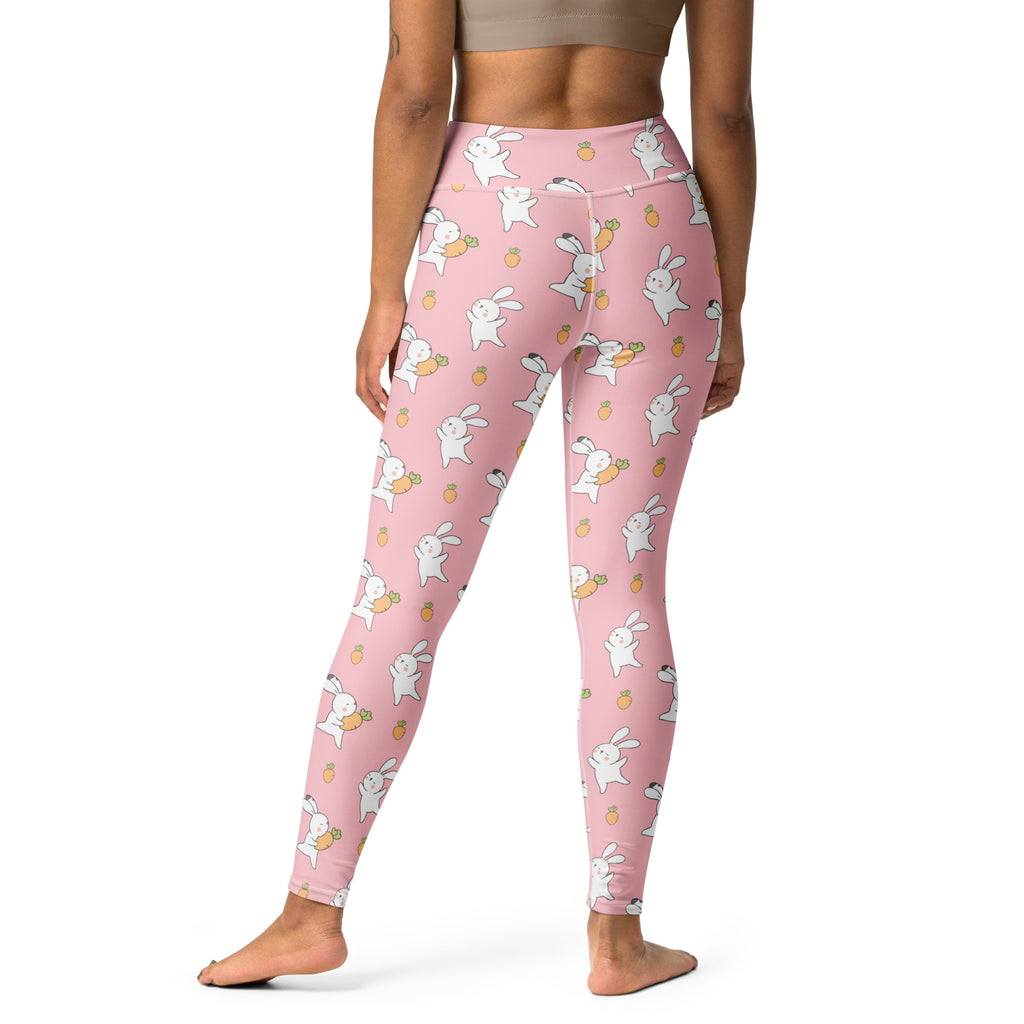 Women’s pink high waisted buttery soft yoga leggings with white bunnies holding carrots and small pineapples pattern