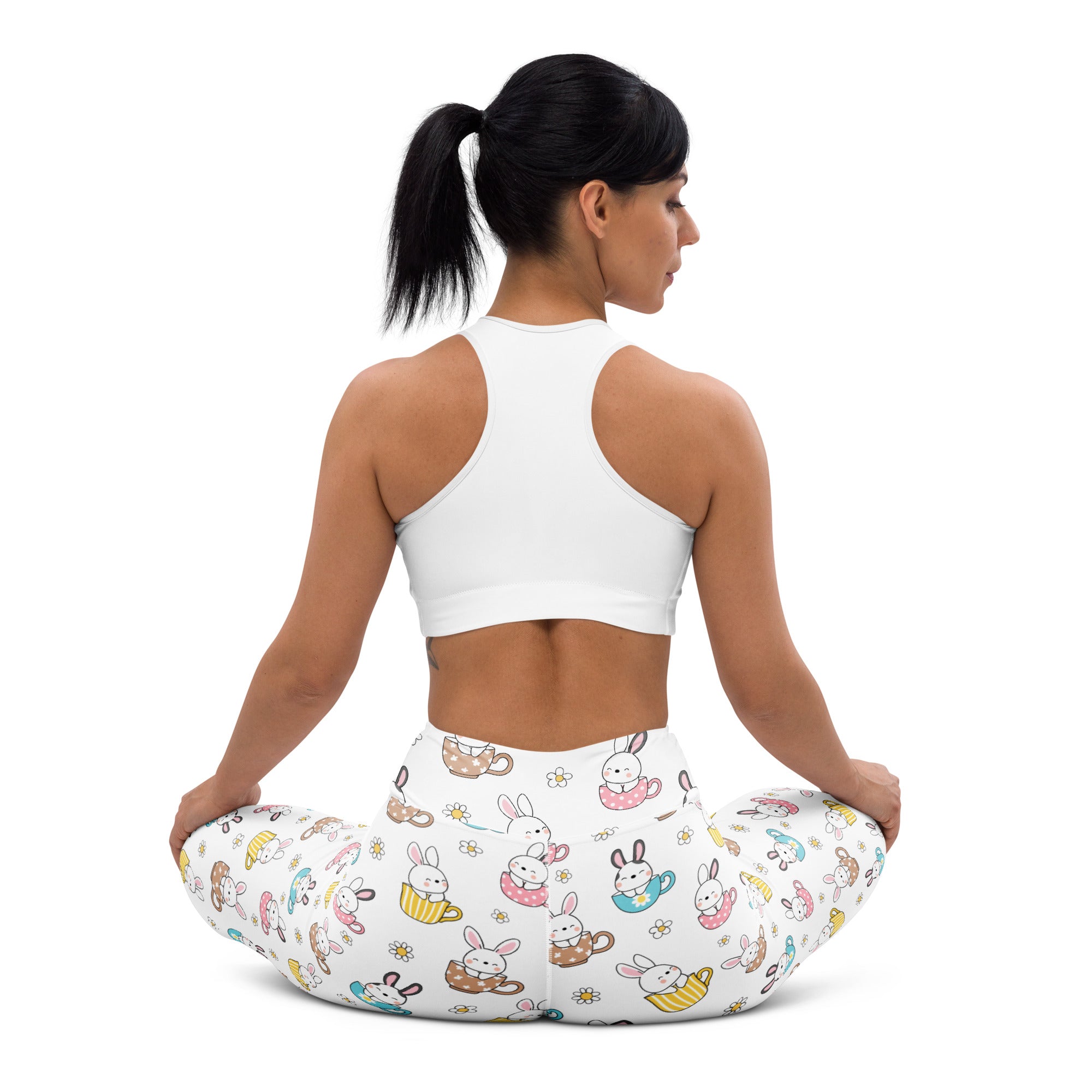 White buttery soft high waisted yoga leggings with cartoon bunnies in teacups and pastel accents for easter