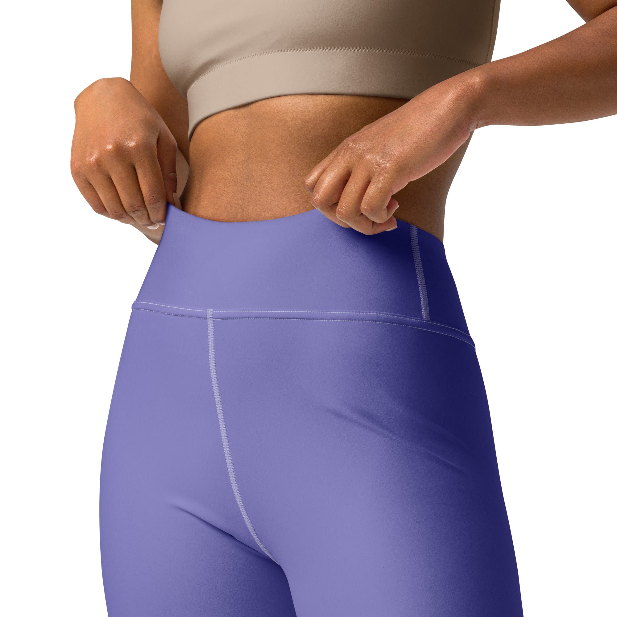 Women’s purple buttery soft yoga leggings in smooth stretchy fabric with subtle white stitching along seams