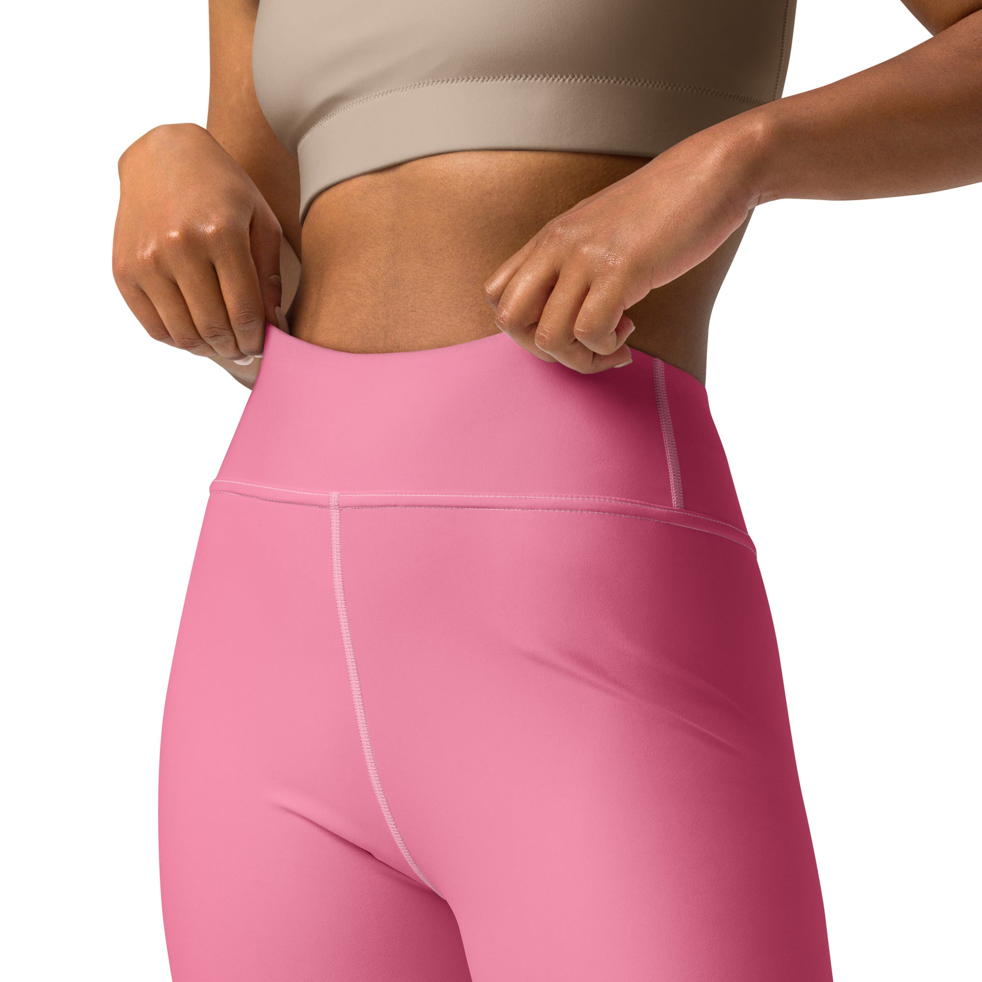 Women’s pink buttery soft yoga leggings with high waist smooth stretchy fabric and subtle white seam stitching