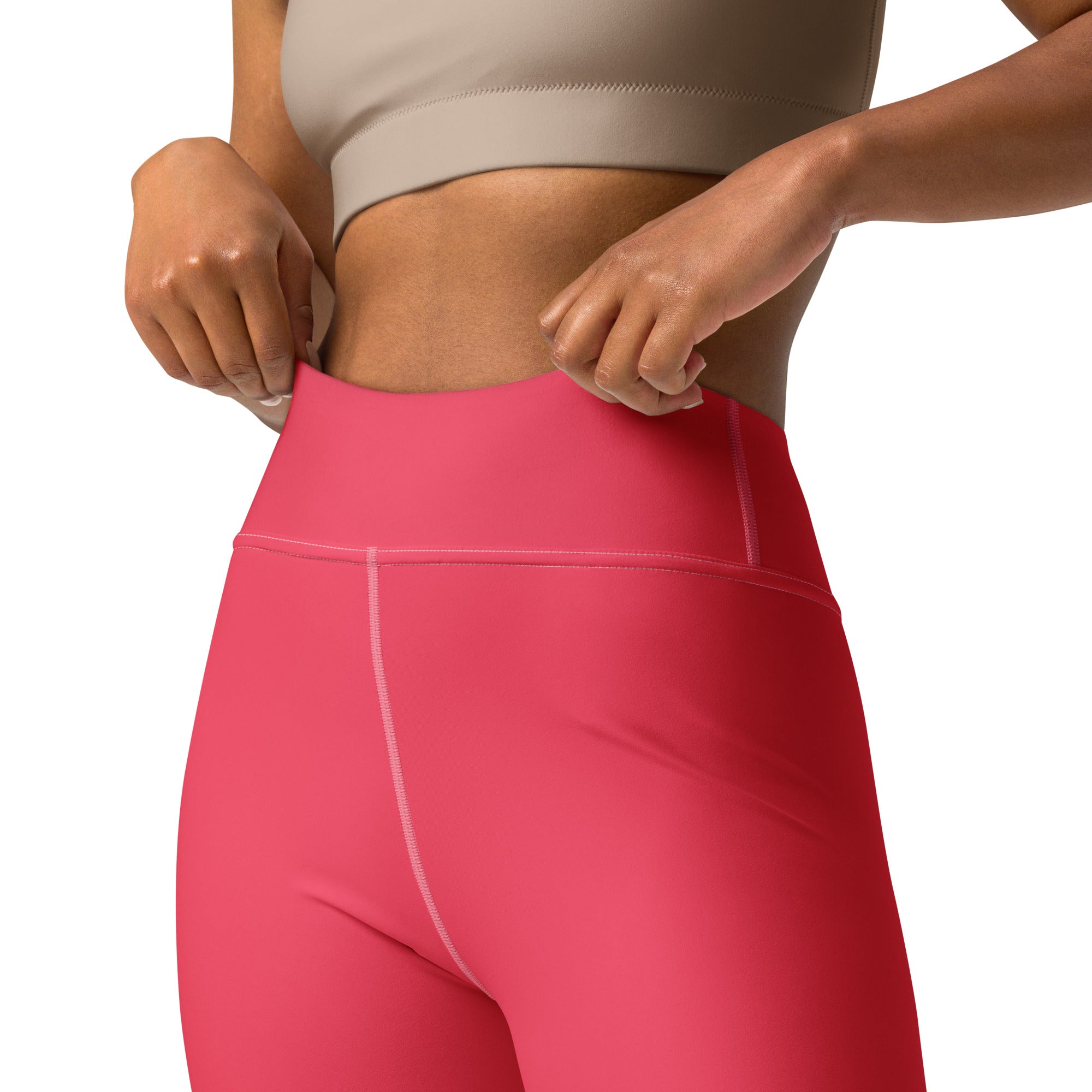 Women’s crimson pink buttery soft yoga leggings in bright pink high-waisted stretchy fabric with white seam stitching