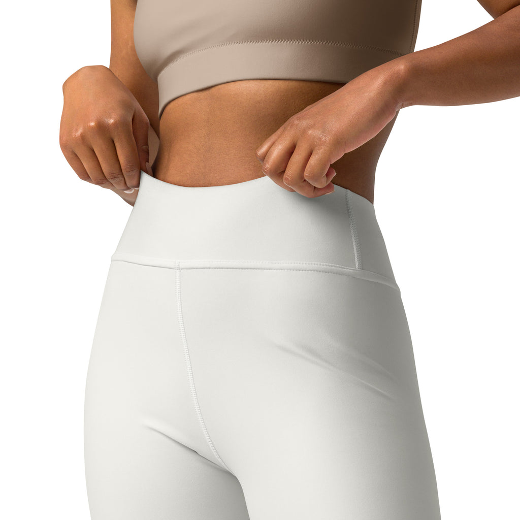 Women’s ivory high-waisted yoga leggings with buttery soft stretchy fabric and subtle seam detailing