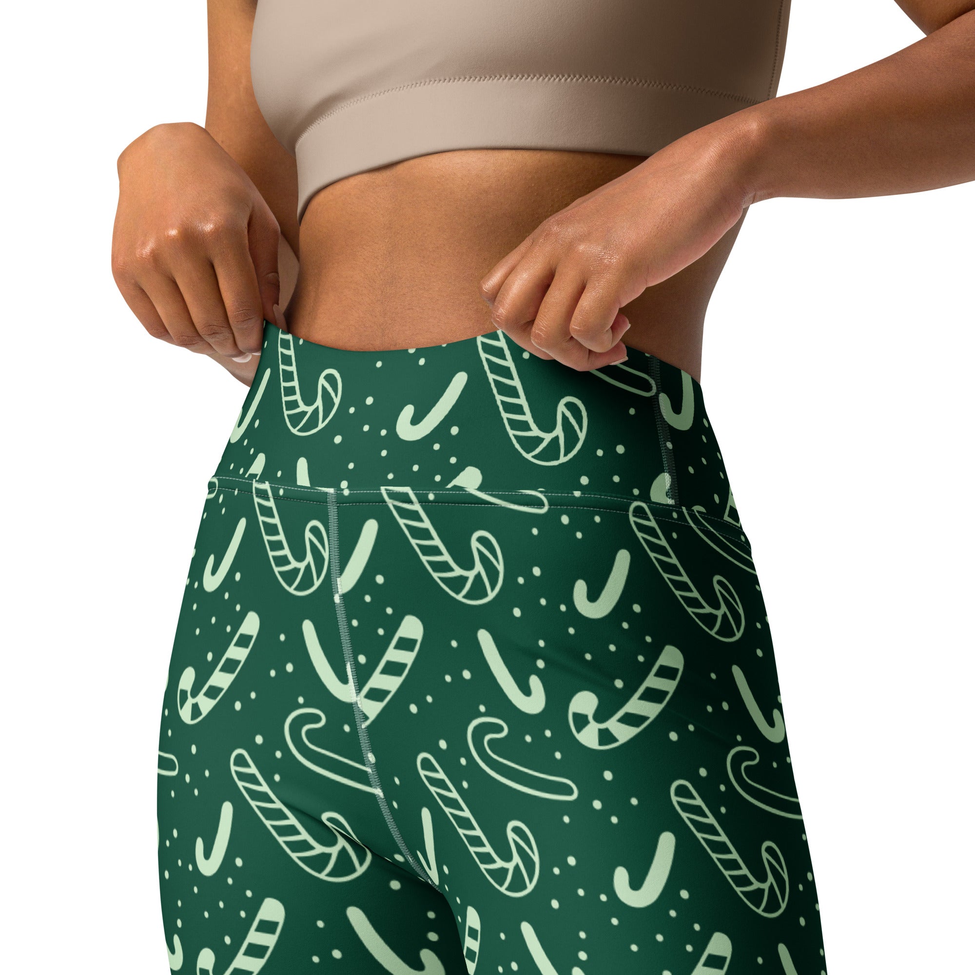 Women’s green candy cane christmas buttery soft high-waisted leggings with festive white candy cane pattern and tiny dots