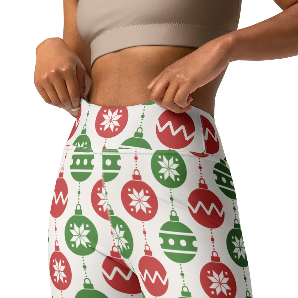 White high-waisted buttery soft yoga leggings with a festive red and green christmas ornament pattern and snowflakes