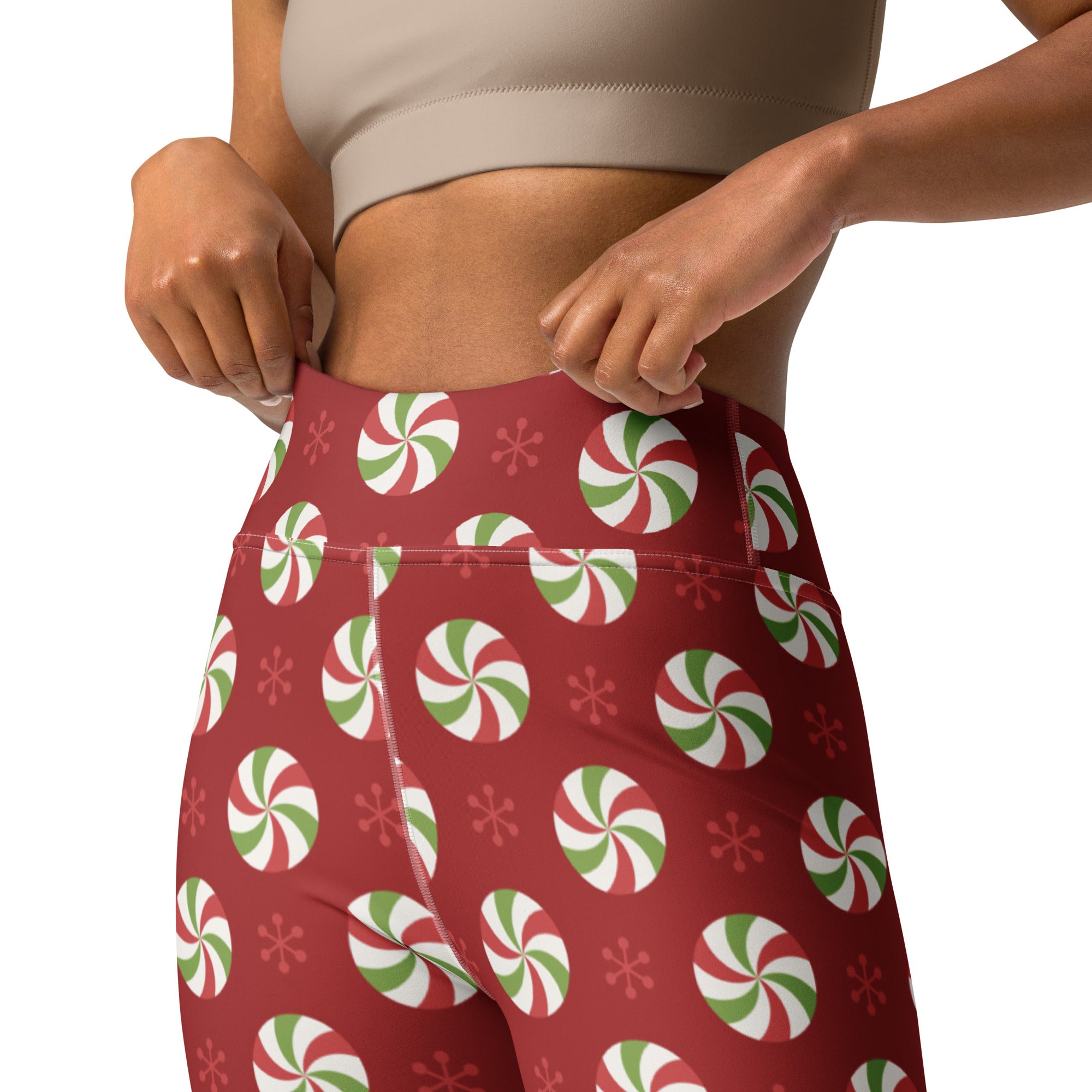 Women’s red high-waisted buttery soft yoga leggings with green and white peppermint candy and snowflake pattern