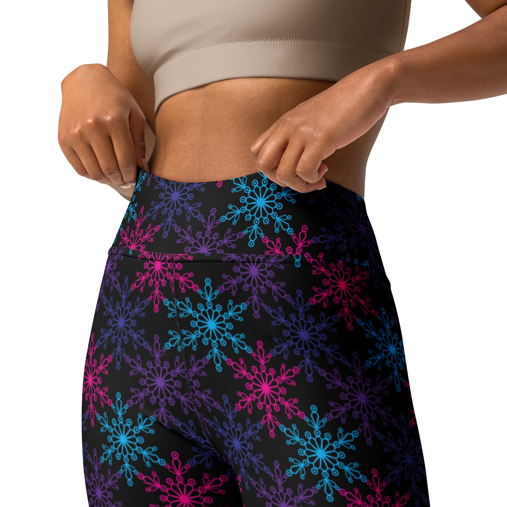 Black high-waisted women’s buttery soft yoga leggings with neon blue and pink snowflake pattern for winter wear