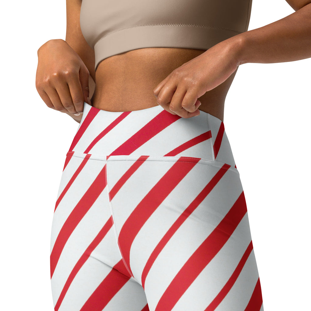 Women’s candy cane stripe buttery soft yoga leggings with red and white diagonal stripes and a snug high-waisted fit