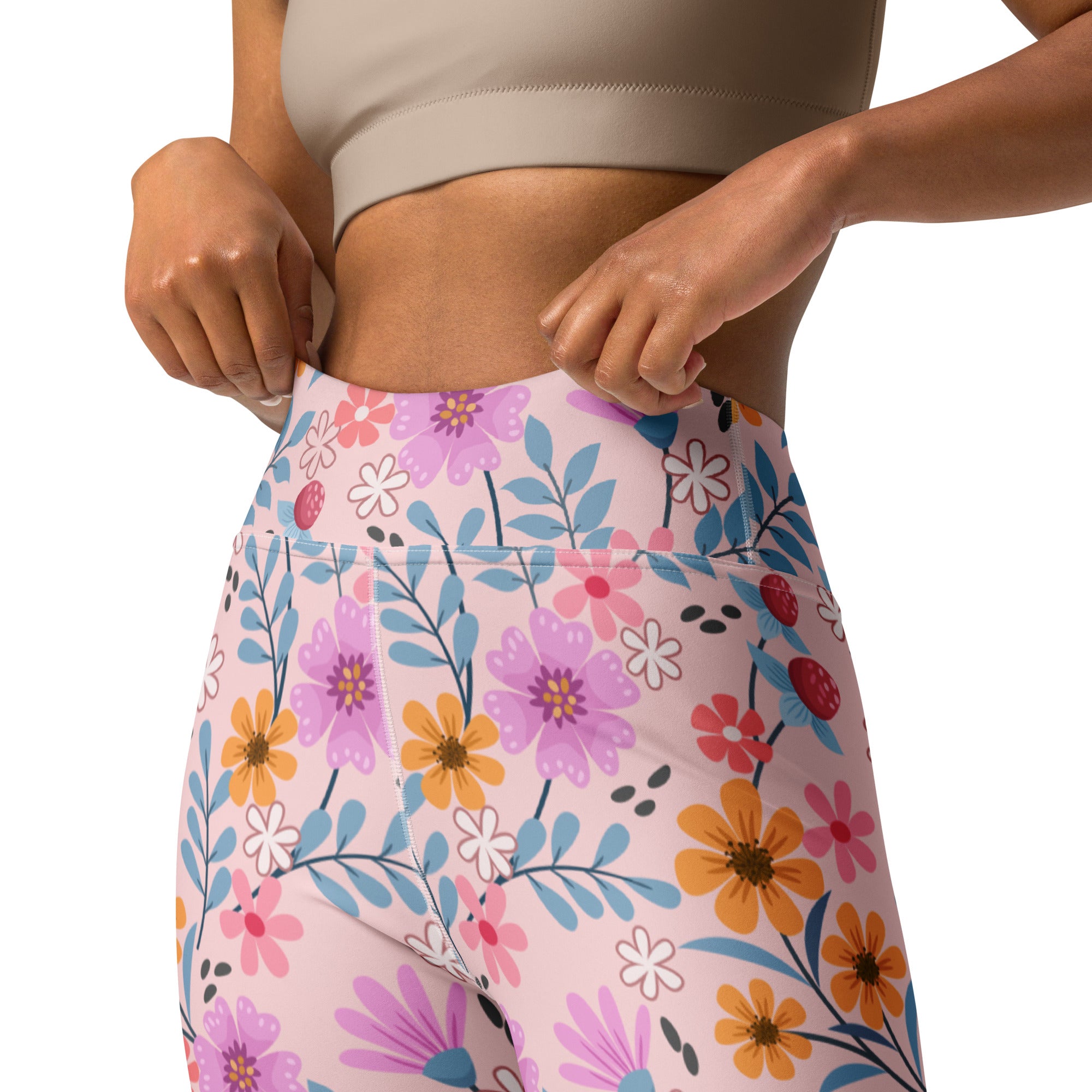 Women’s pink floral buttery soft high-waisted yoga leggings with vibrant purple orange white flowers and blue leaves