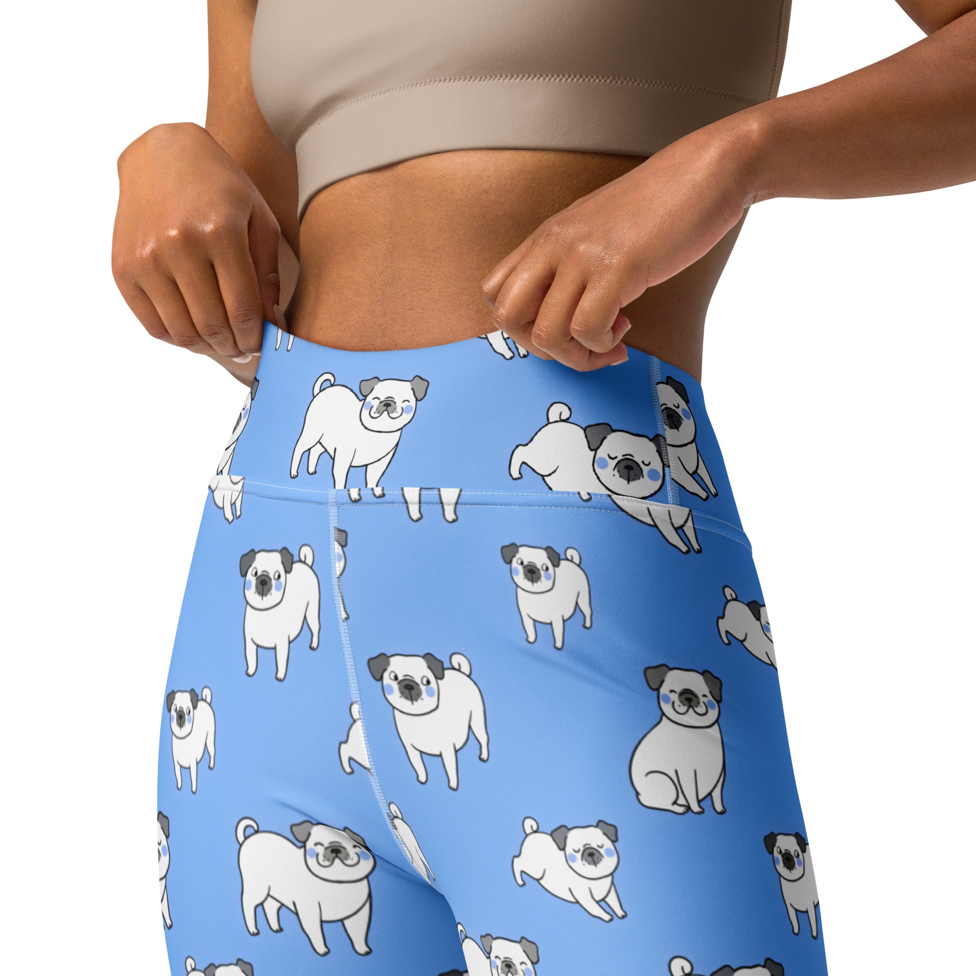 Light blue high-waisted buttery soft yoga leggings for women with a playful white pug pattern and black ears and noses
