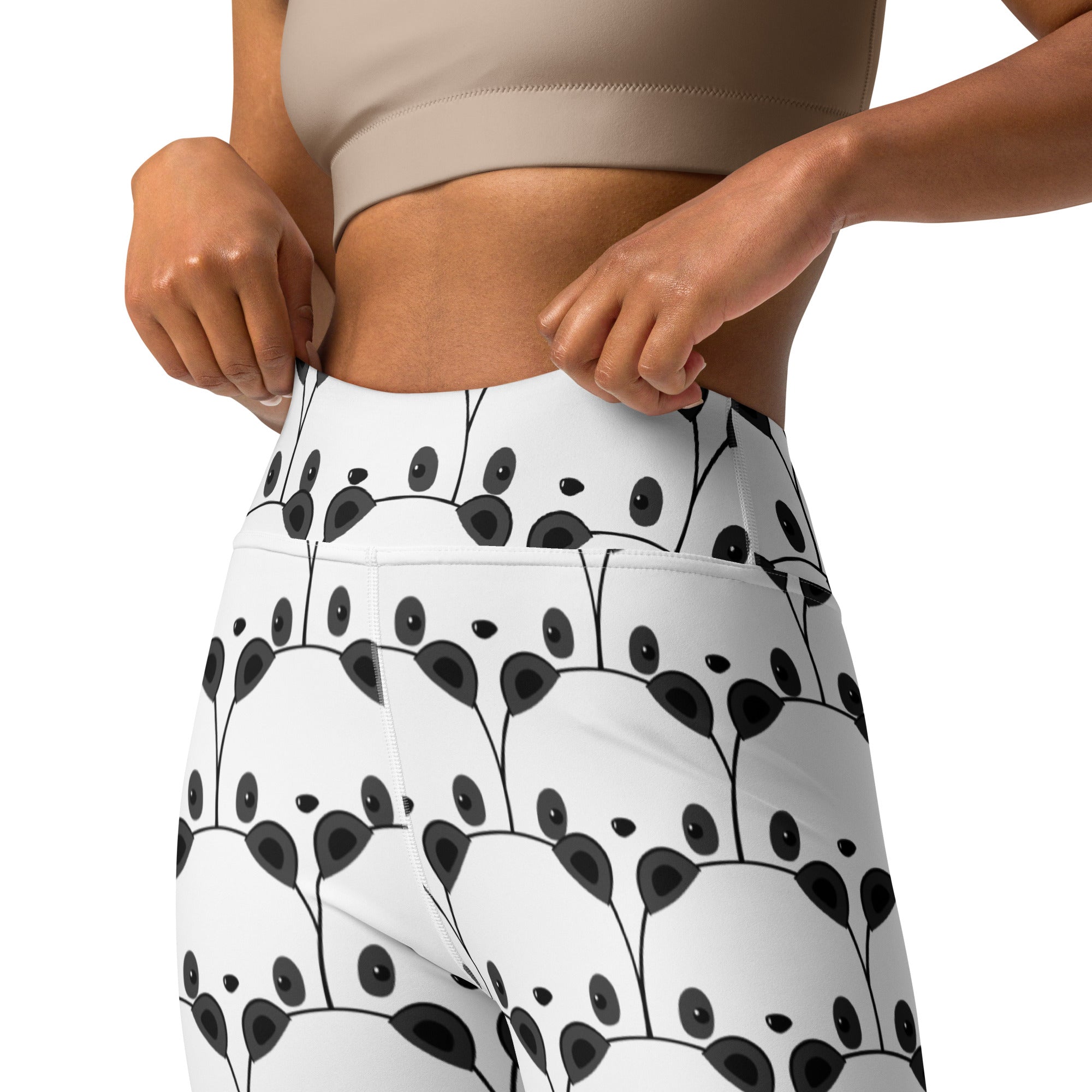 White high-waisted buttery soft yoga leggings with playful black panda face pattern for women