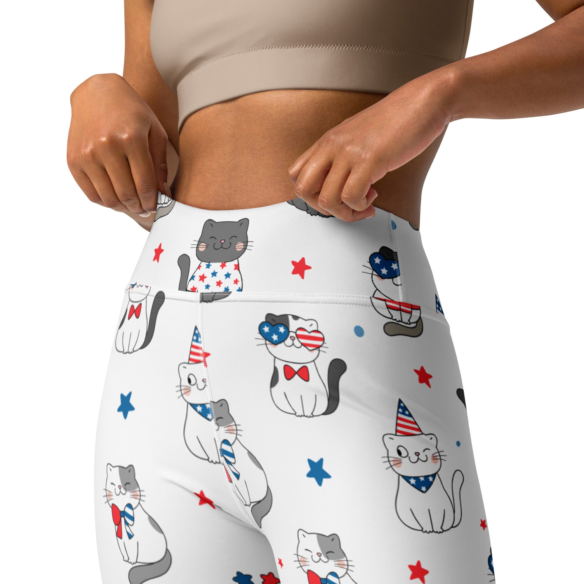 White high-waisted buttery soft yoga leggings with playful cartoon cats wearing patriotic american-themed accessories