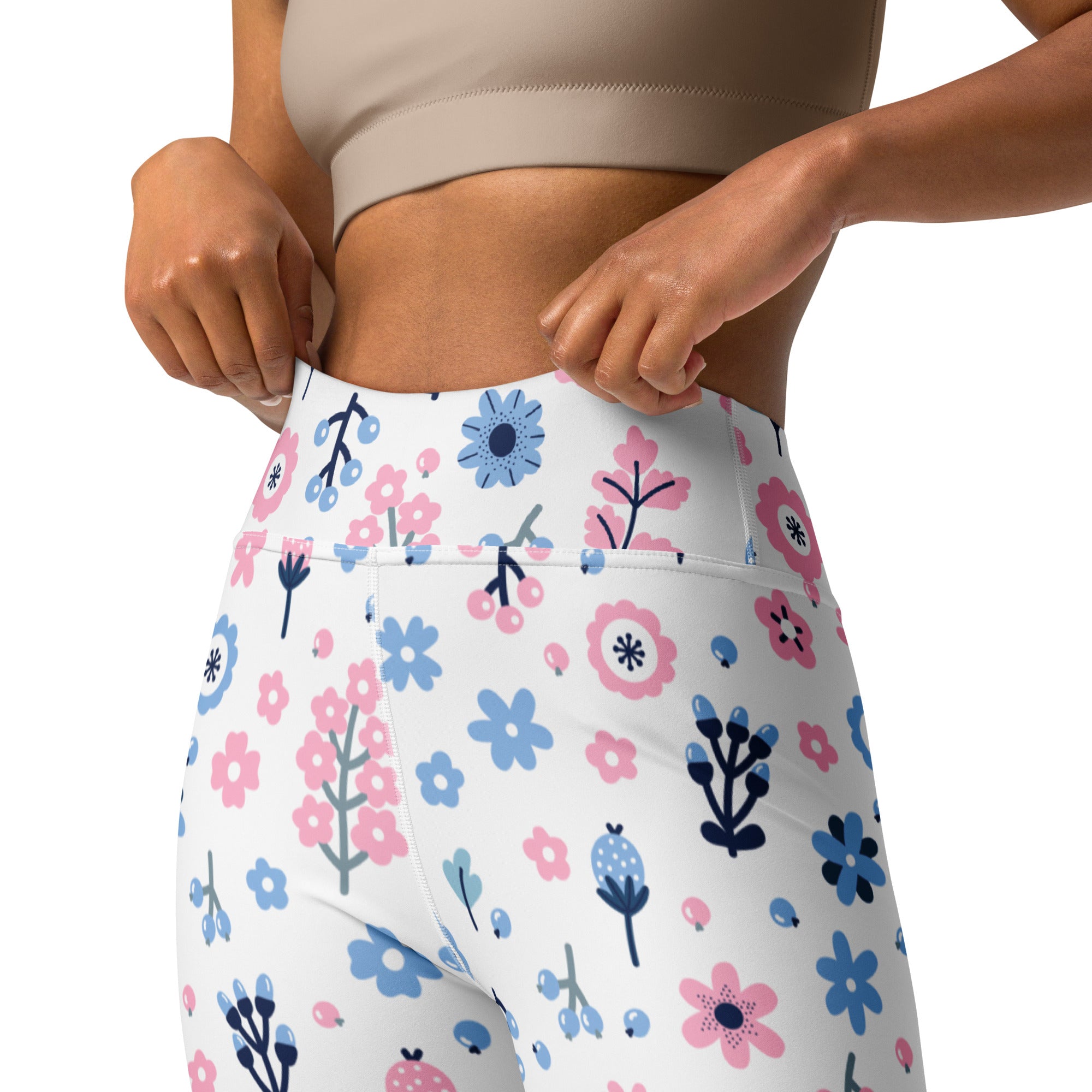 White high-waisted buttery soft yoga leggings with a playful pink and blue floral pattern and green stems for women
