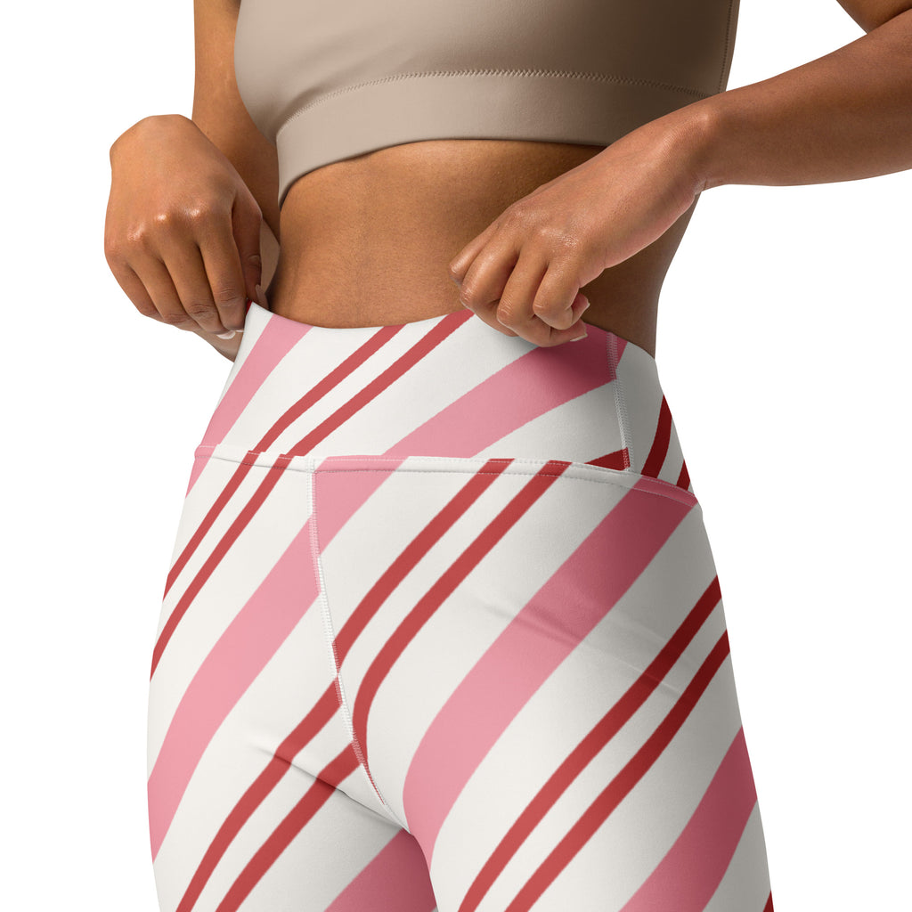 Women’s candy cane stripe buttery soft high-waisted yoga leggings with pink and white diagonal stripes