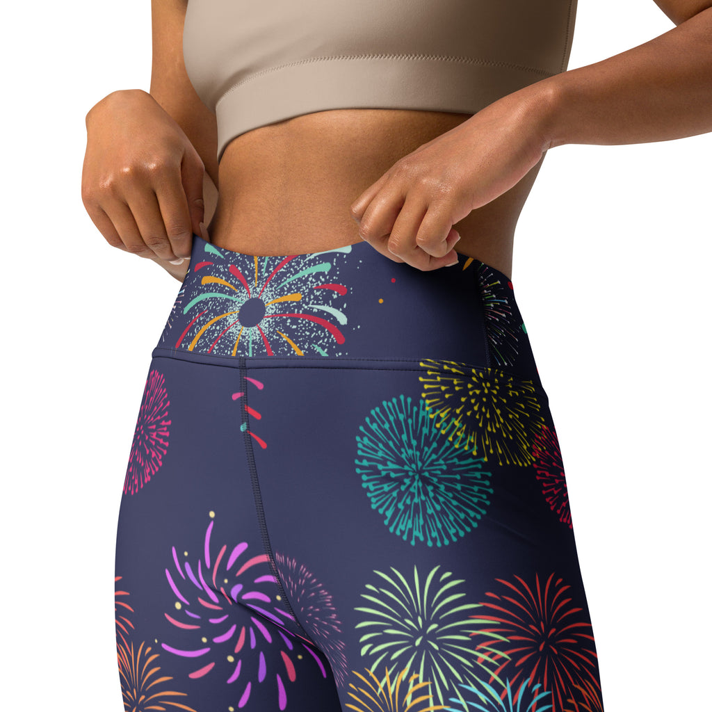 Dark blue high waisted buttery soft yoga leggings with a vibrant multicolored fireworks pattern for women