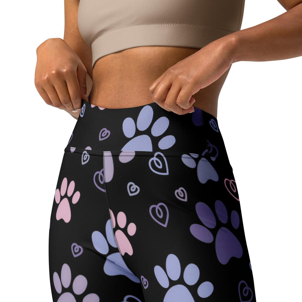 Black high-waisted buttery soft yoga leggings with pastel pink light blue and purple paw print and heart pattern