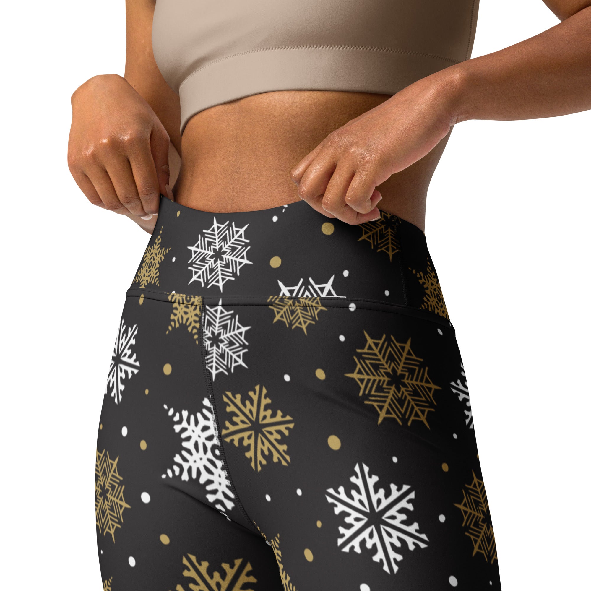 Black high-waisted buttery soft yoga leggings with white and gold snowflake pattern for women