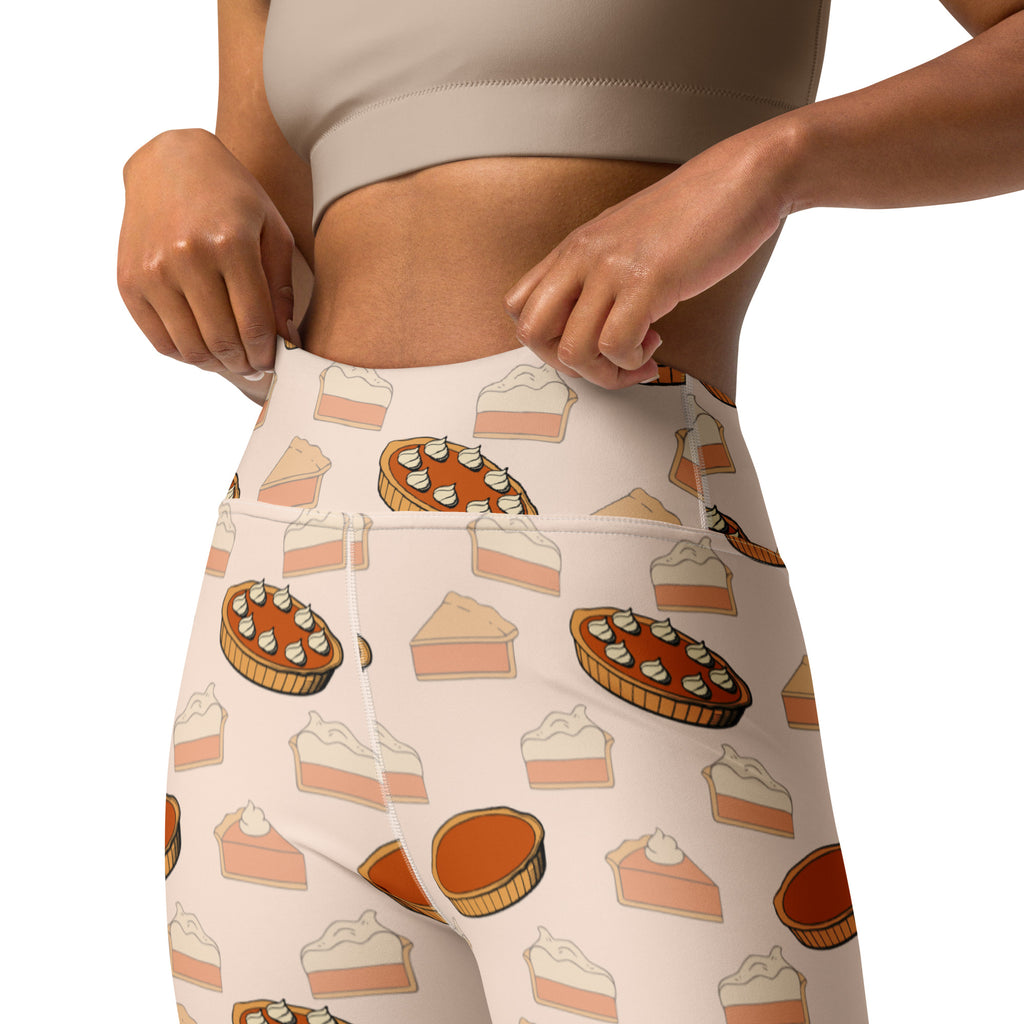 White high-waisted buttery soft yoga leggings with playful pumpkin pie pattern in warm orange brown and cream tones