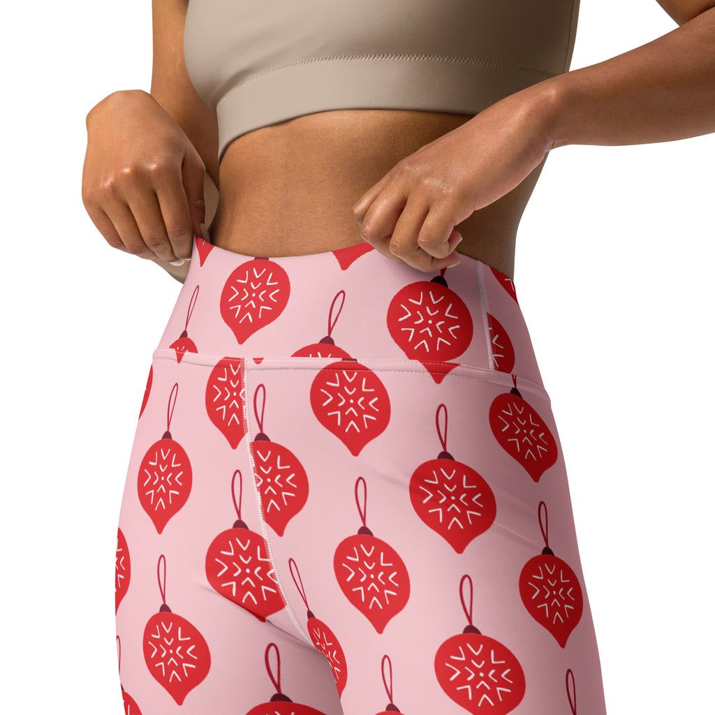 Women’s pink high-waisted buttery soft yoga leggings with red christmas ornament and white snowflake pattern