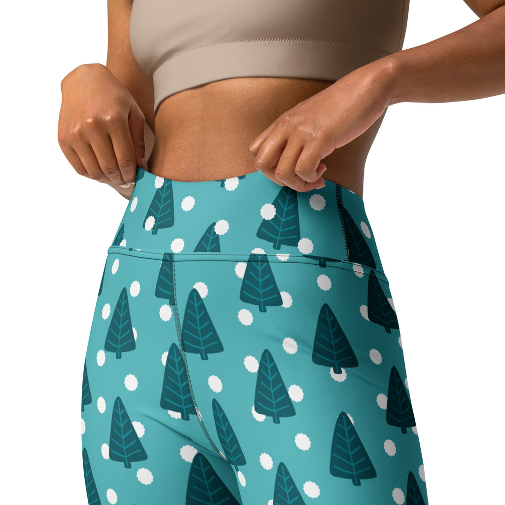 Women’s teal high-waisted buttery soft yoga leggings with dark green pine tree pattern and white polka dots