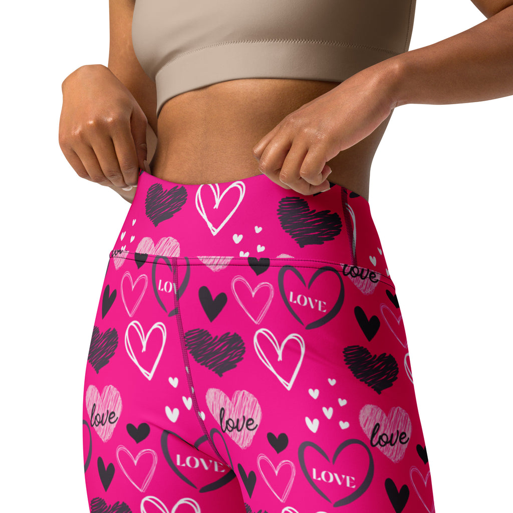 Bright pink high waisted buttery soft yoga leggings with black and white love heart pattern and quick drying fabric