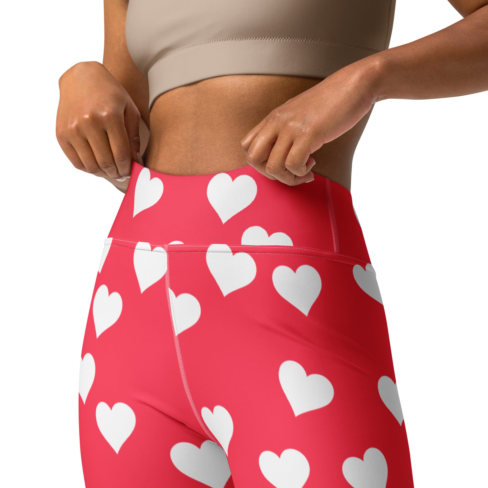 Red high-waisted yoga leggings with white heart print made from buttery soft quick drying fabric for women