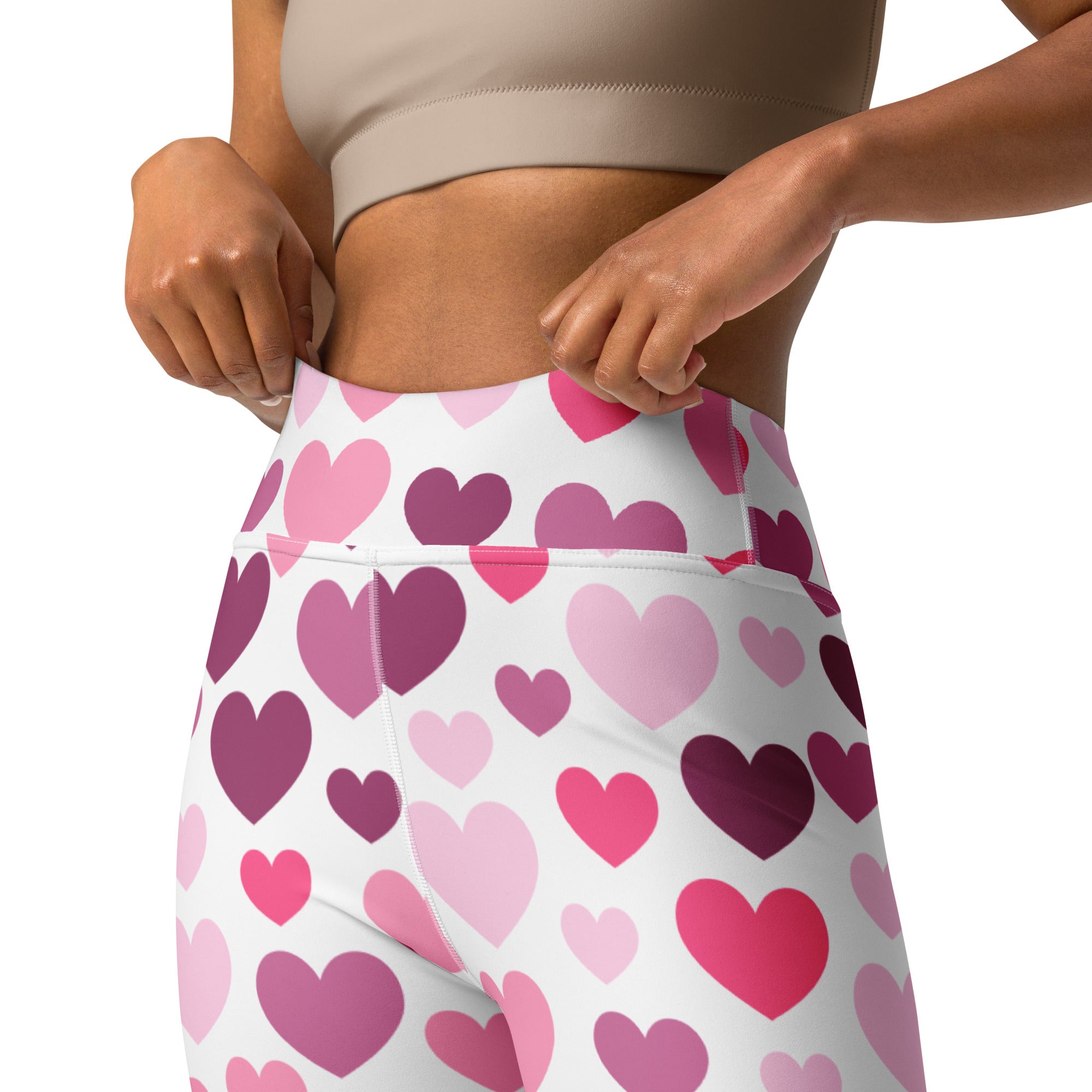 White high-waisted buttery soft yoga leggings with vibrant pink and purple heart pattern for valentine comfort