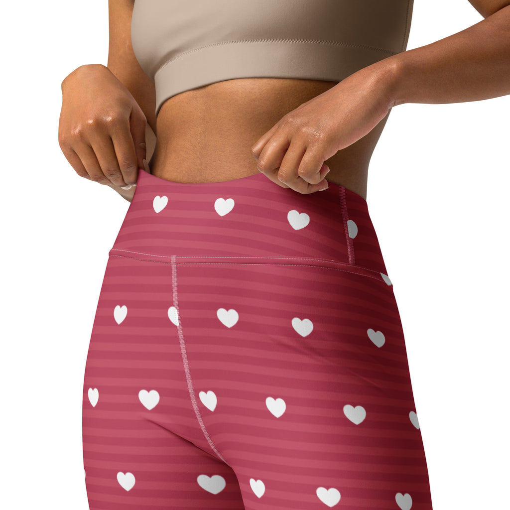 Women’s pink heart stripe high waisted yoga leggings with subtle stripes made of buttery soft quick drying fabric
