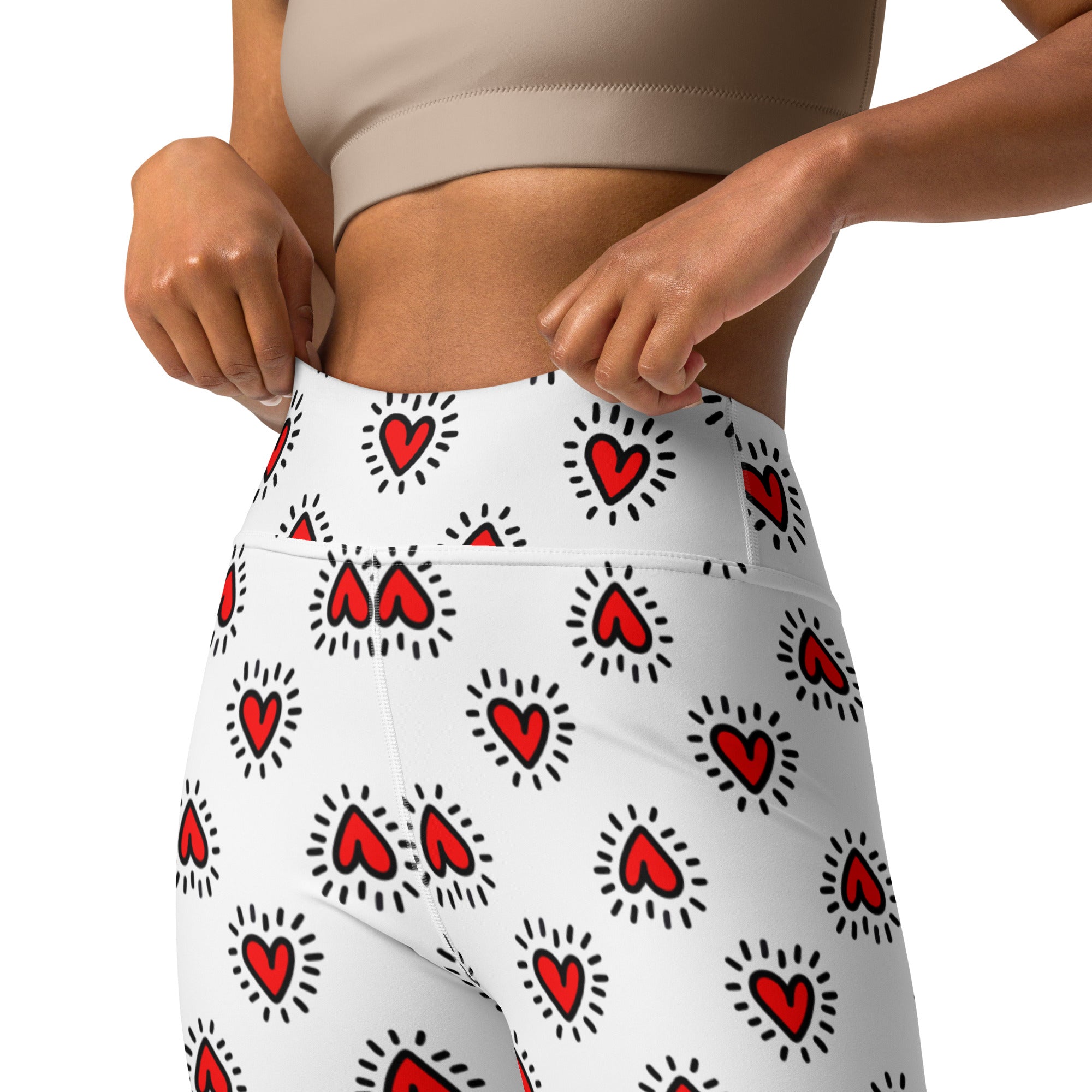Women’s white high waisted buttery soft yoga leggings with radiating red heart pattern designed for quick drying comfort