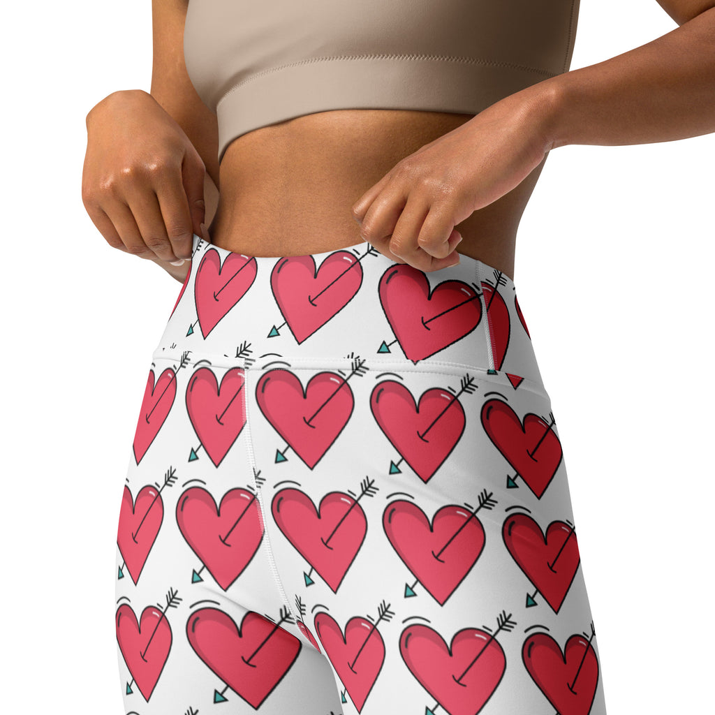 Women’s white high waisted buttery soft yoga leggings with quick drying fabric and red heart arrow pattern