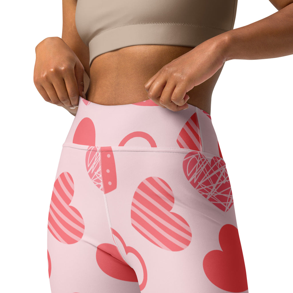 Women’s pink heart pattern high waisted yoga leggings made from soft stretchy quick drying fabric