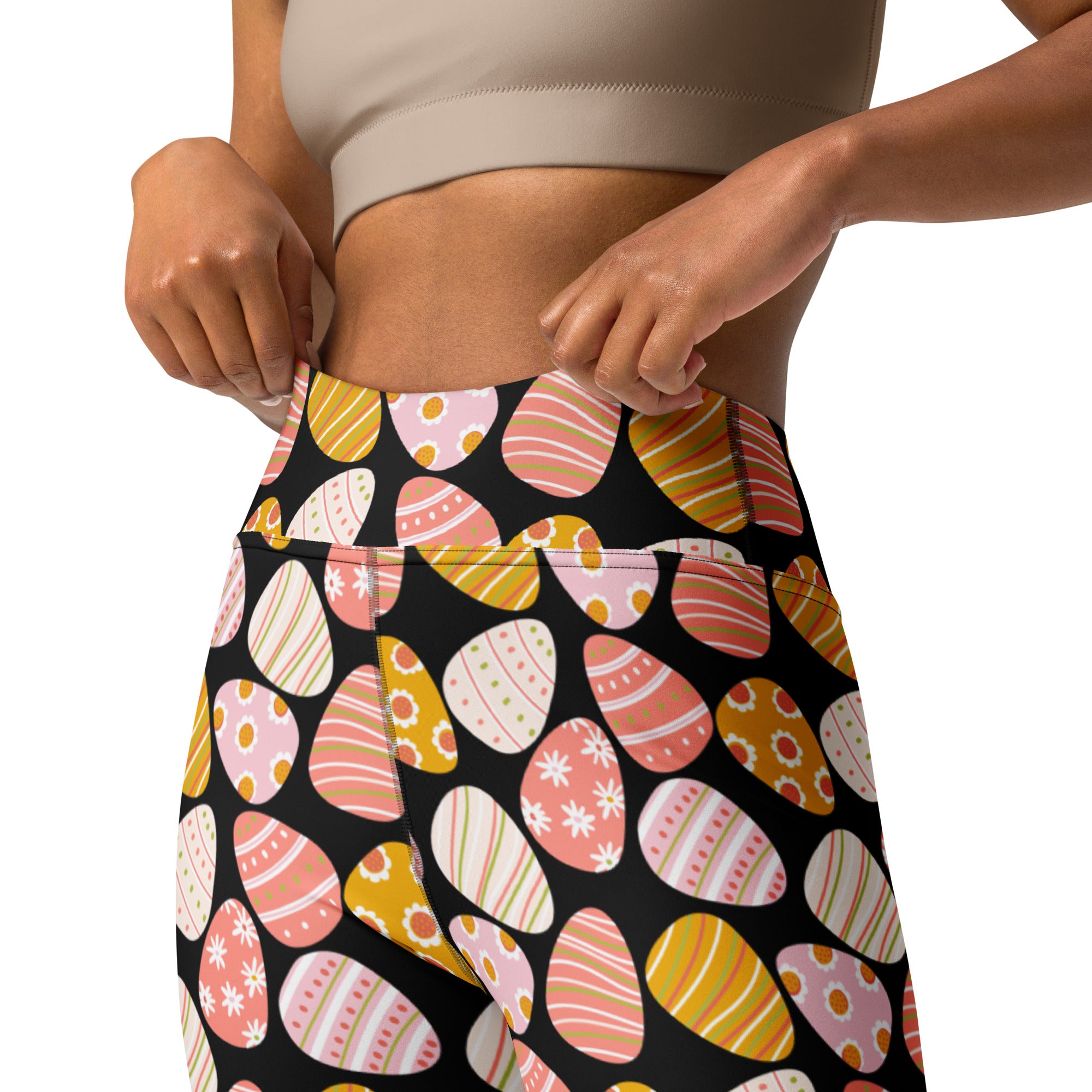 Black high-waisted buttery soft yoga leggings with pastel pink peach and mustard easter eggs quick drying comfort