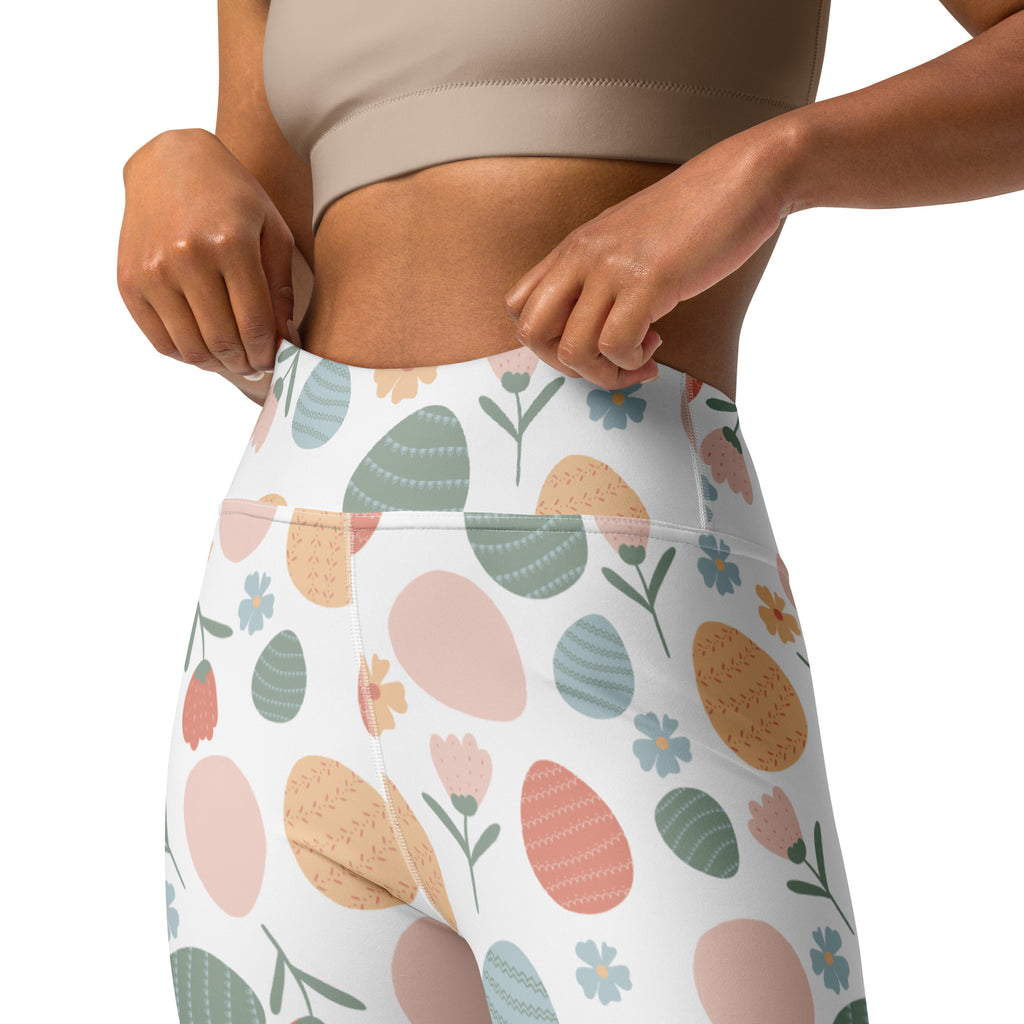 White high waisted buttery soft yoga leggings with pastel easter egg and floral pattern in pink green blue and beige