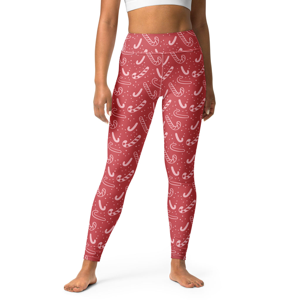 Women’s red high-waisted buttery soft yoga leggings with a white candy cane and tiny dot pattern for Christmas