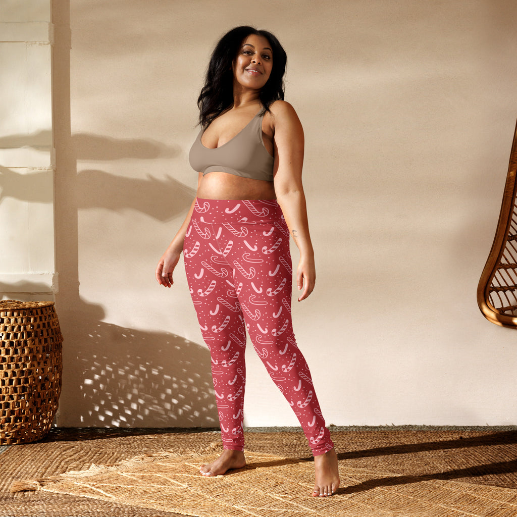 Women’s red buttery soft yoga leggings with white candy cane pattern perfect for Christmas workouts