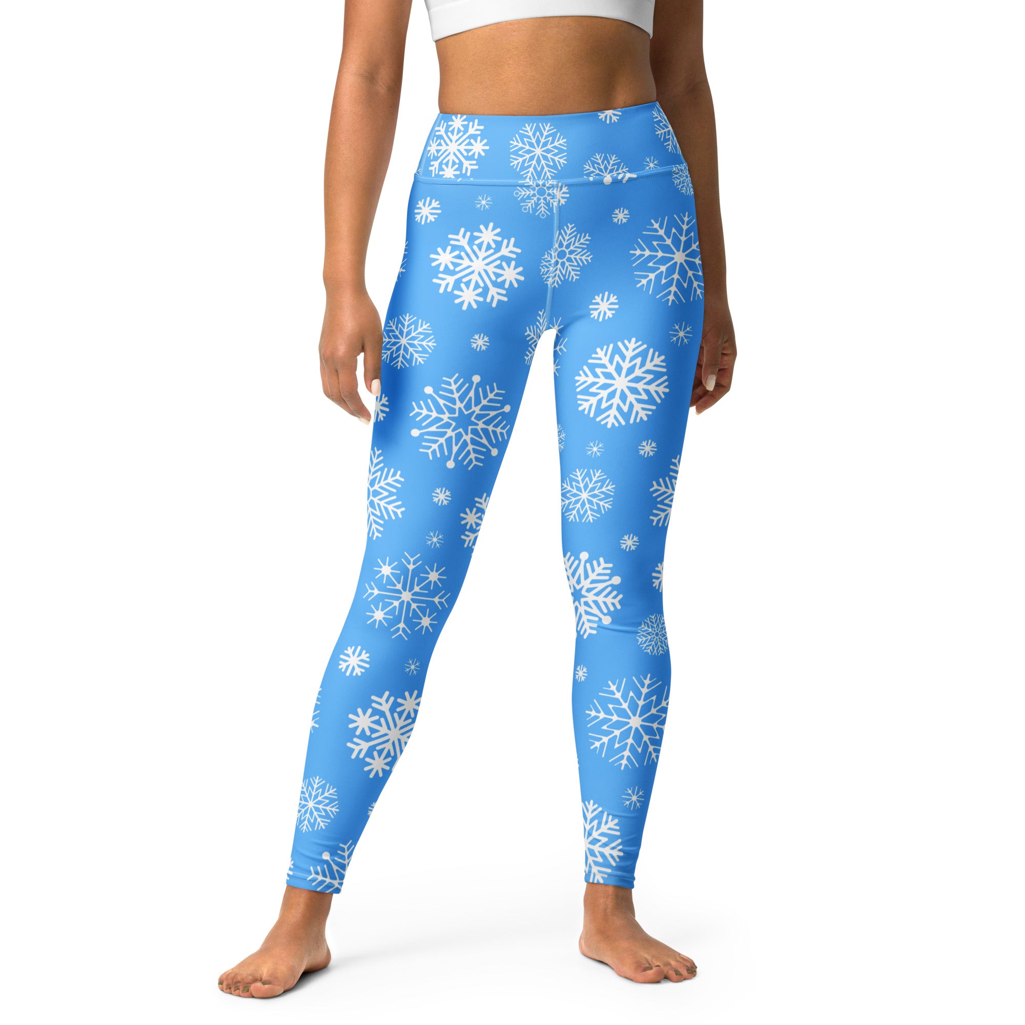 Blue high waisted buttery soft yoga leggings for women with white snowflake pattern for winter workouts