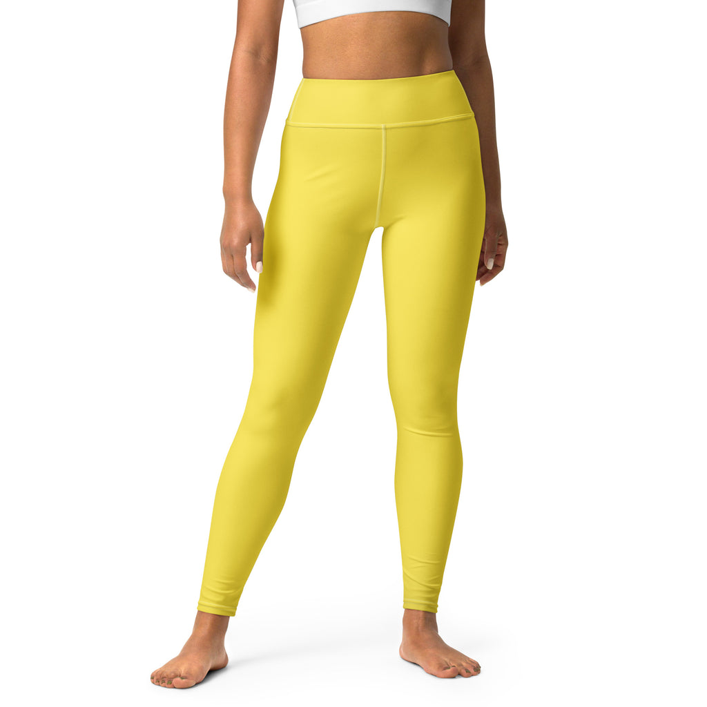 Bright yellow high-waisted buttery soft yoga leggings made of stretchy form-fitting fabric for women