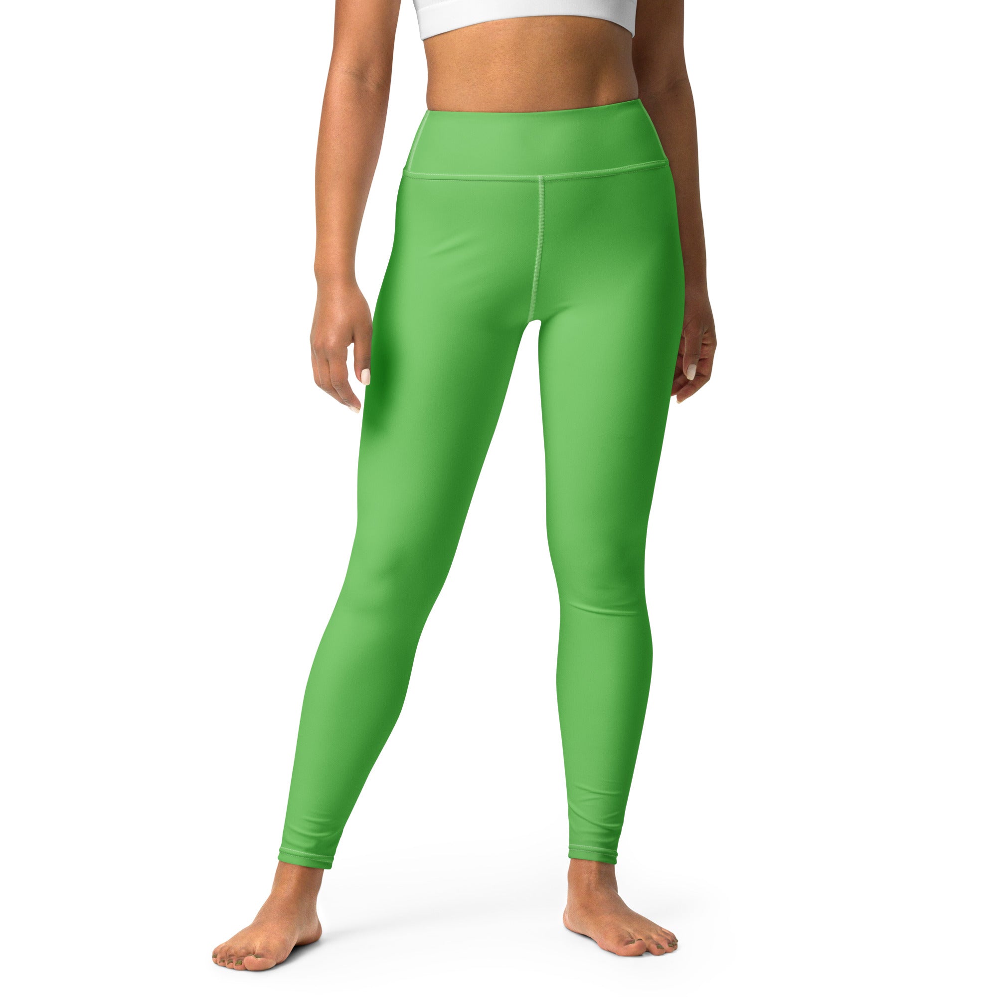 Women’s green buttery soft yoga leggings made of bright green high-waisted stretchy form-fitting fabric