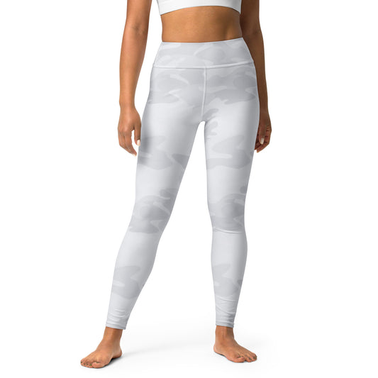 Person wearing white leggings on a white background