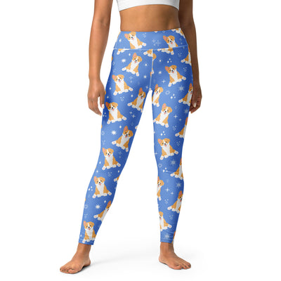 Blue leggings with corgi dog pattern worn by a person on a white background
