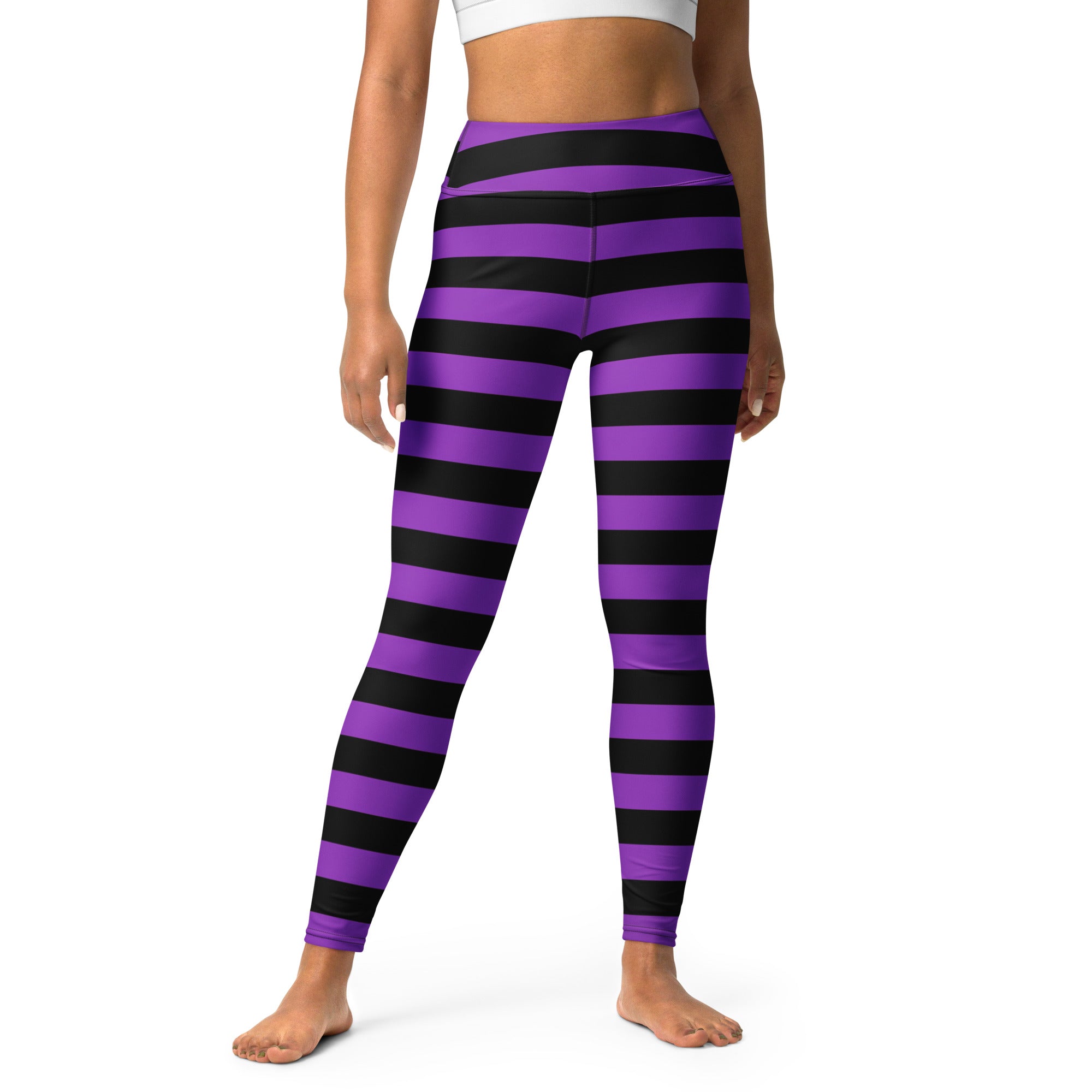 Women’s purple and black striped high-waisted buttery soft yoga leggings for halloween visible from front side
