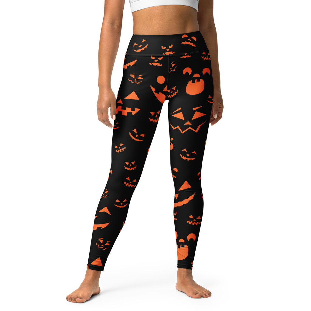 Women’s black high-waisted buttery soft yoga leggings with vibrant orange jack-o-lantern and bat halloween pattern